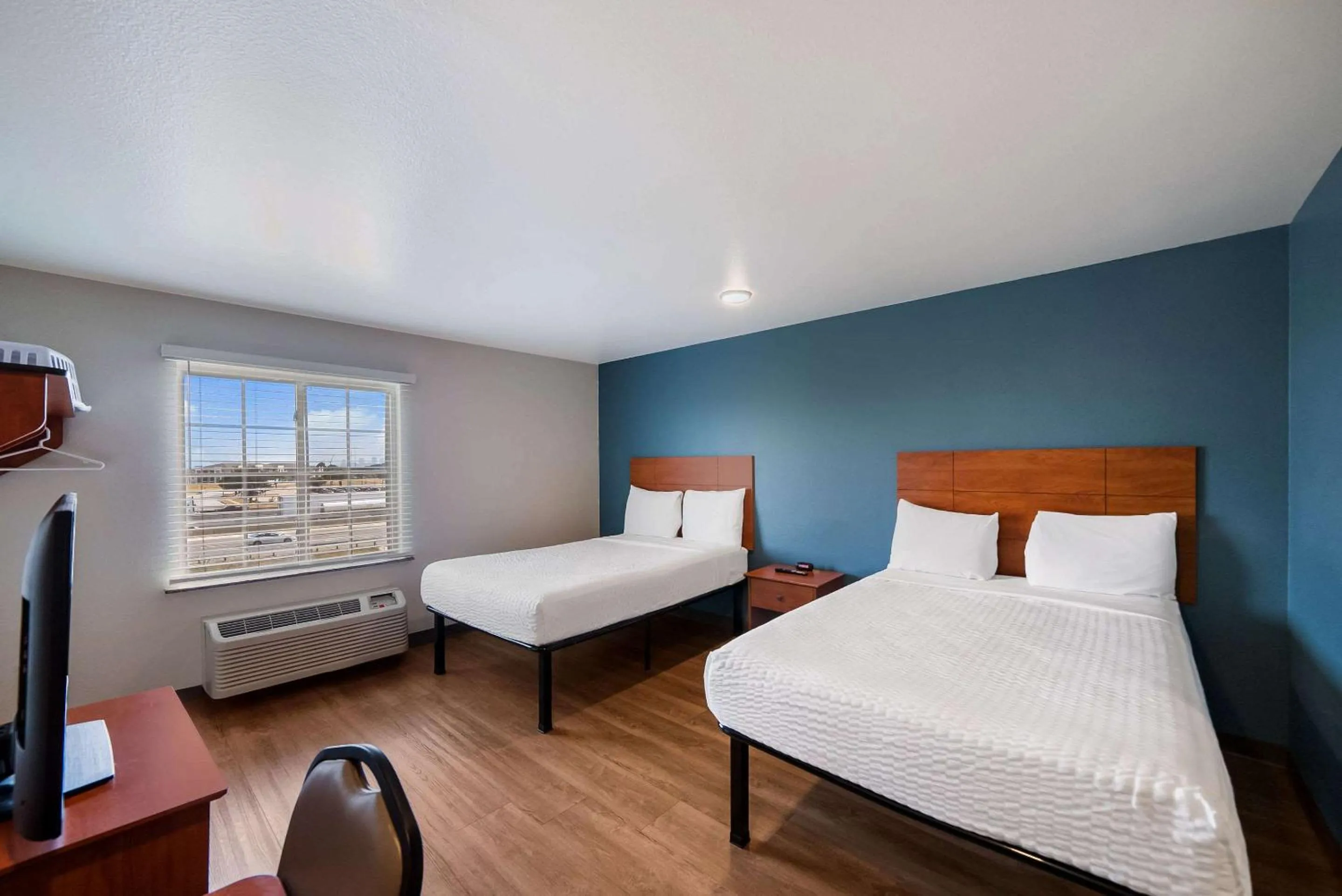 Bedroom, Bed in WoodSpring Suites Fort Worth Fossil Creek