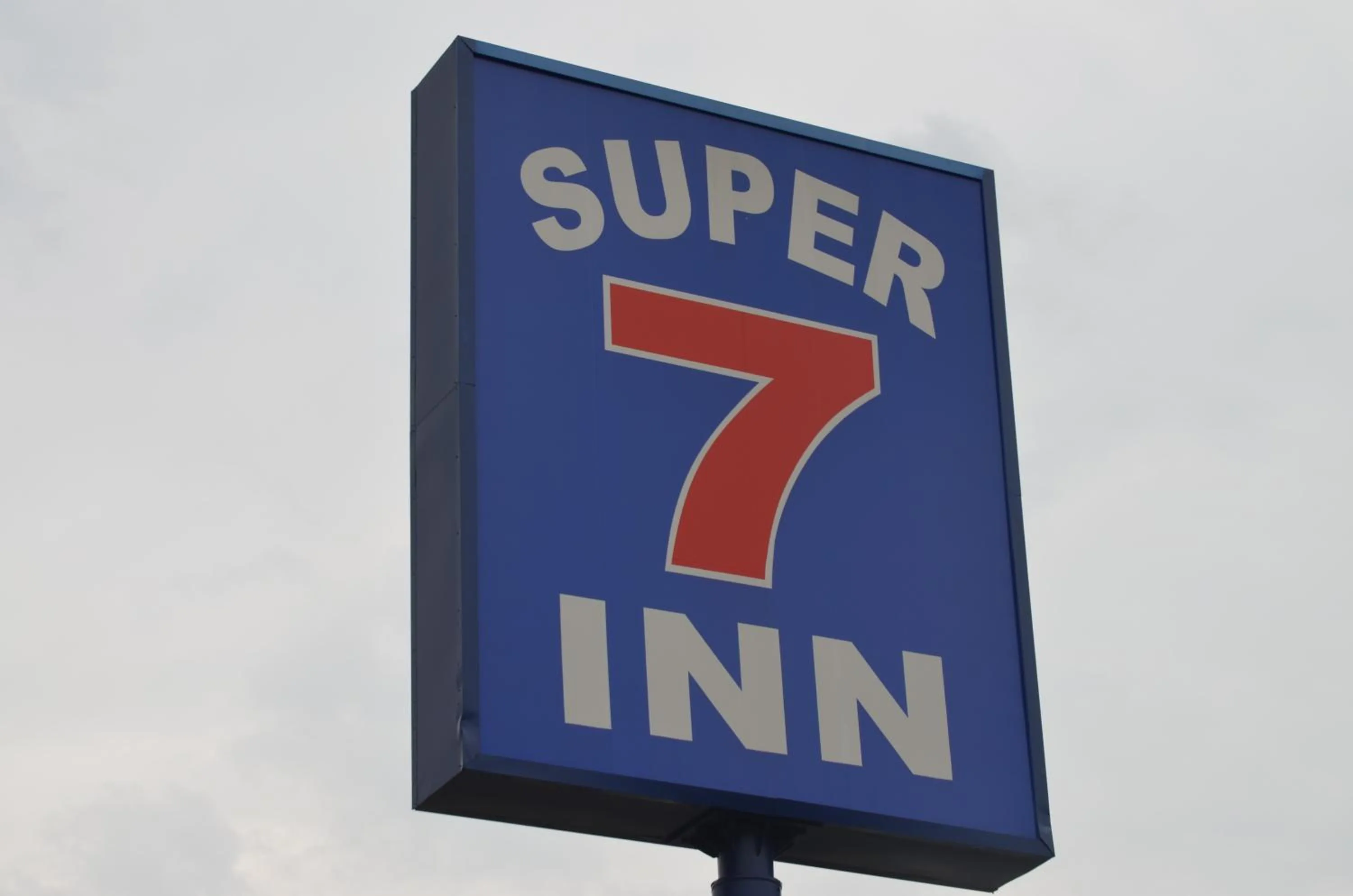 Property logo or sign in Super 7 Inn