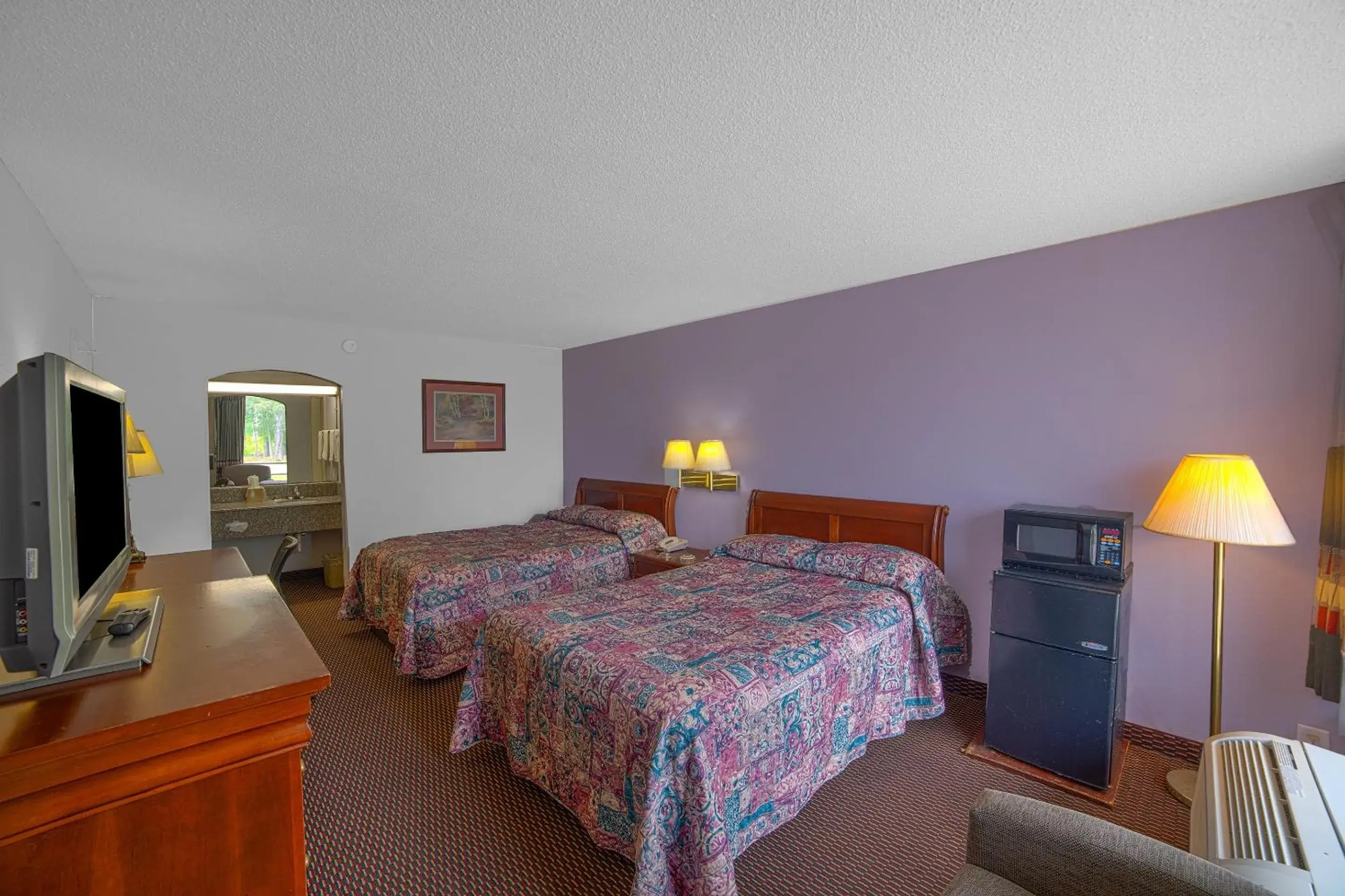 Bedroom, Bed in Masters Inn Selma Smithfield I-95 By OYO Bedroom, Bed in Masters Inn Selma Smithfield I-95 By OYO