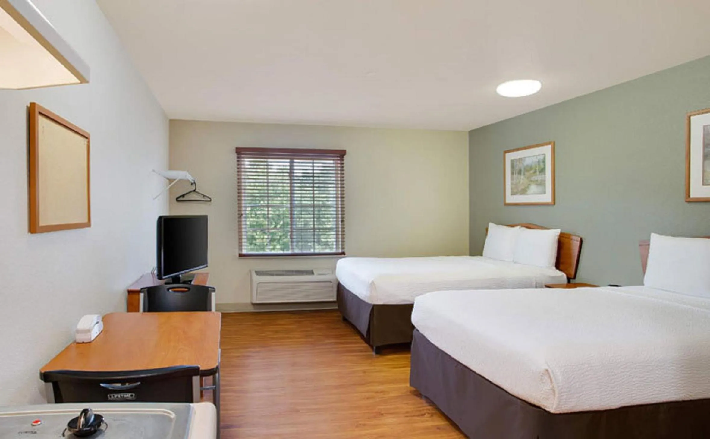 Photo of the whole room, Bed in WoodSpring Suites Louisville Southeast