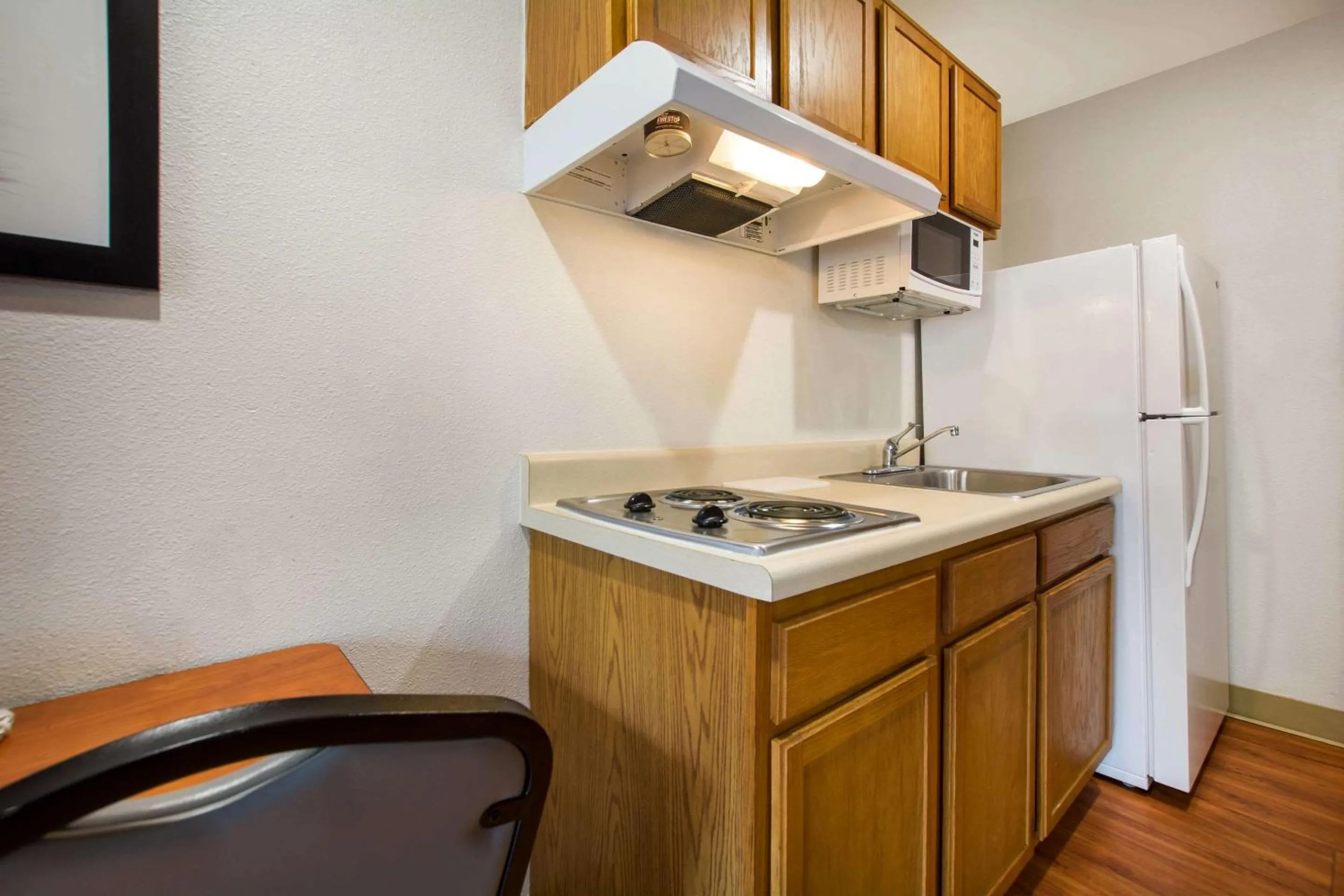 Bedroom in WoodSpring Suites Louisville Southeast