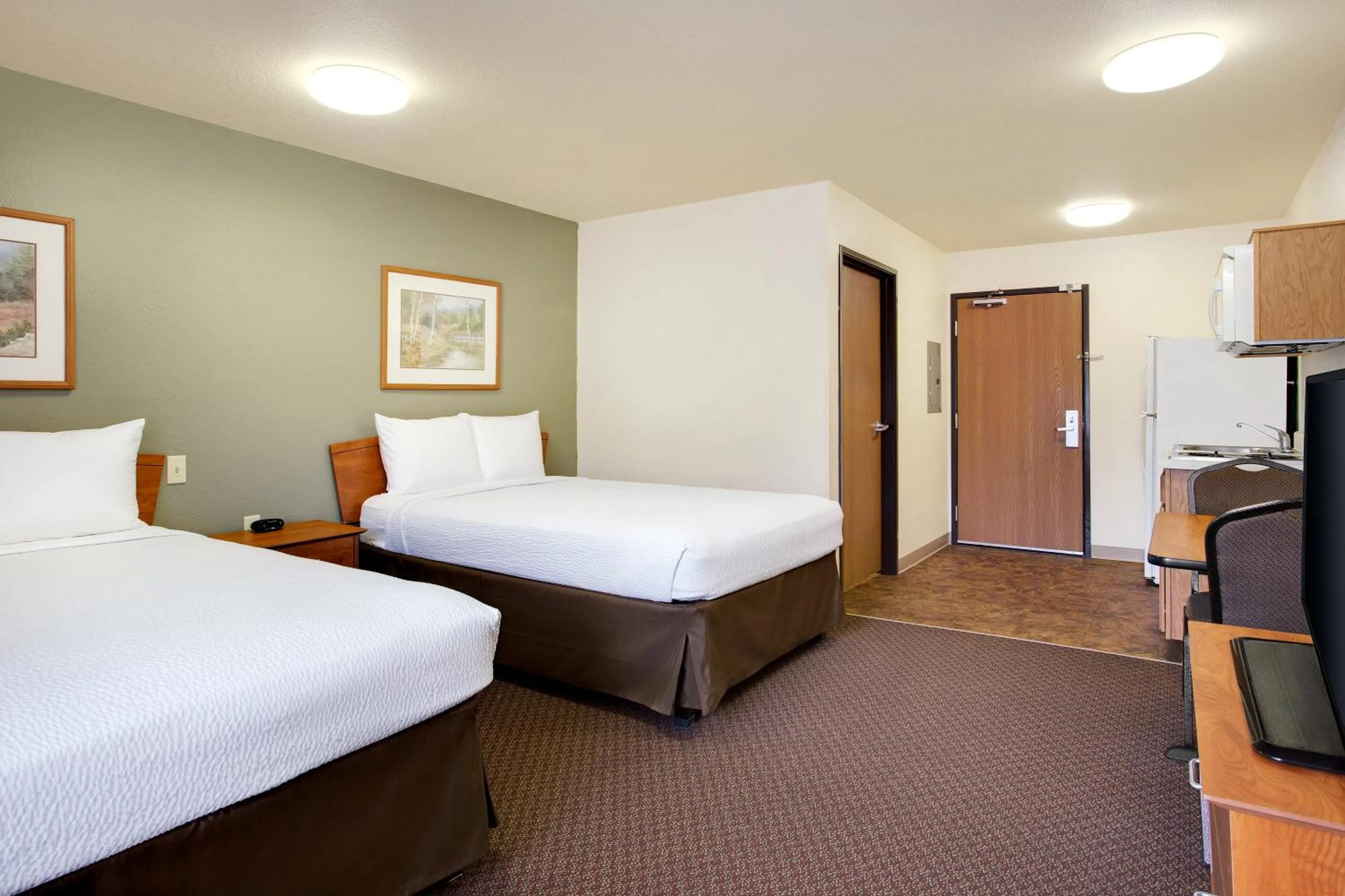 Bed in WoodSpring Suites Richmond Colonial Heights Fort Gregg-Adams