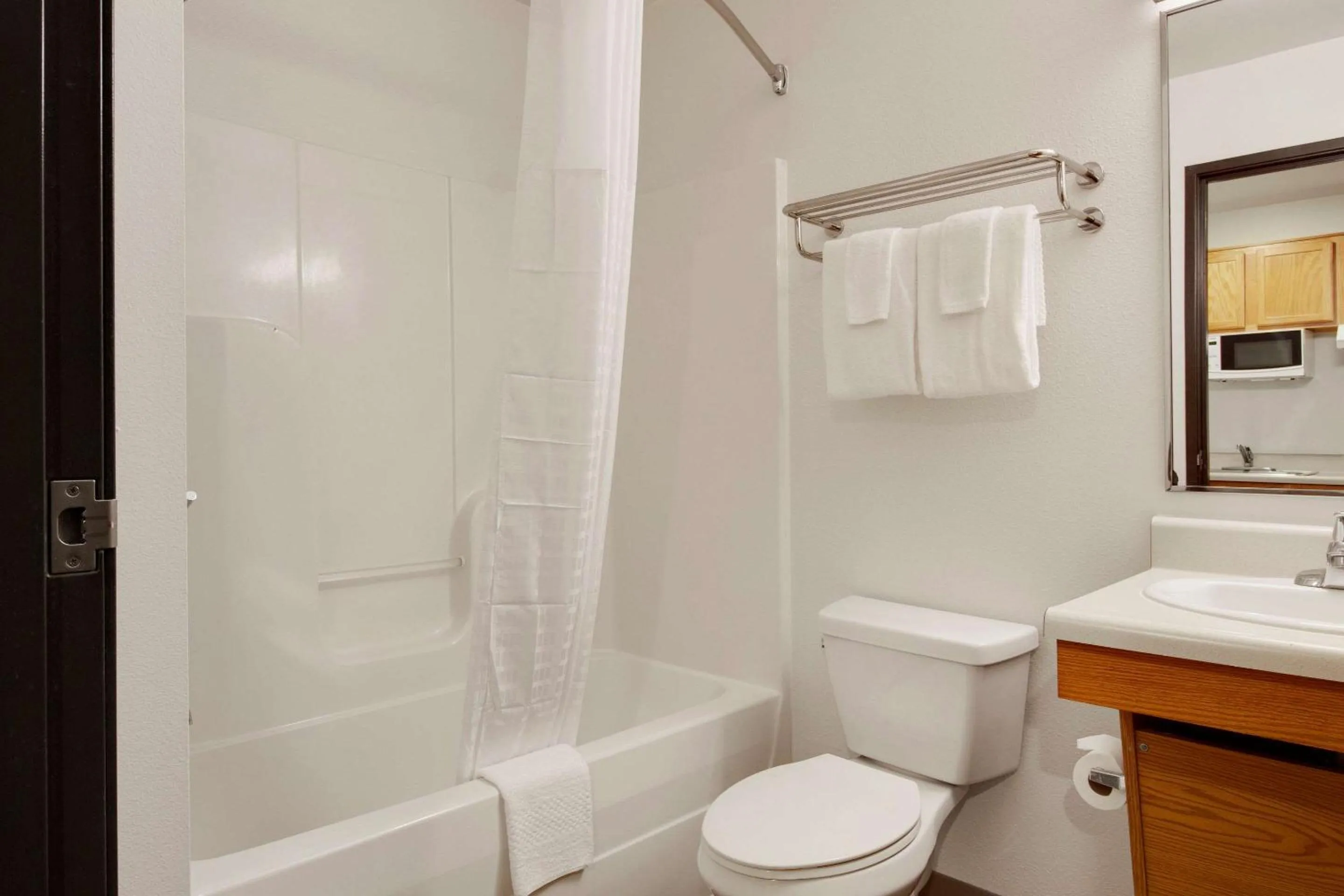 Bathroom in WoodSpring Suites Conroe