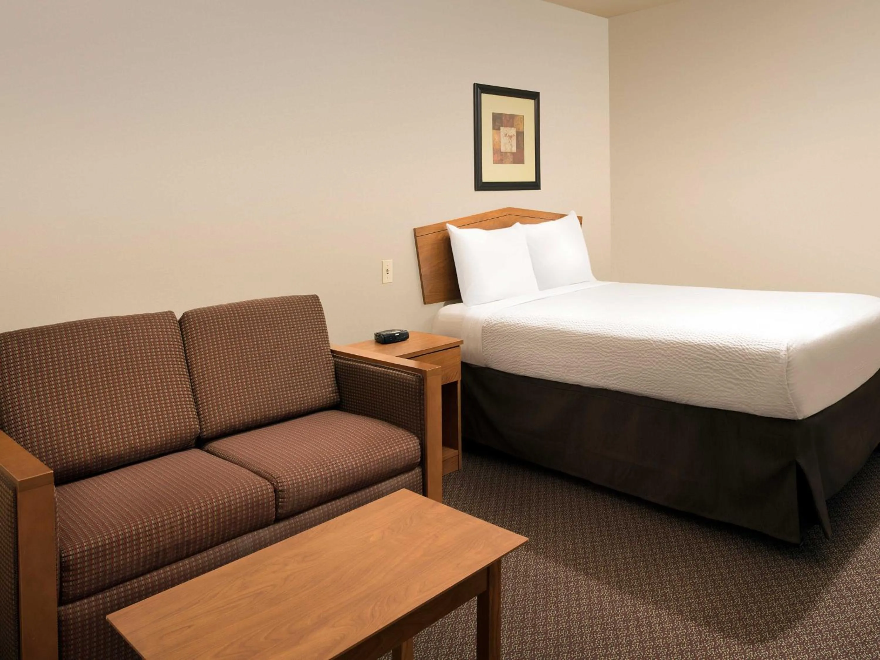 Bedroom, Bed in WoodSpring Suites Omaha Bellevue, an Extended Stay Hotel