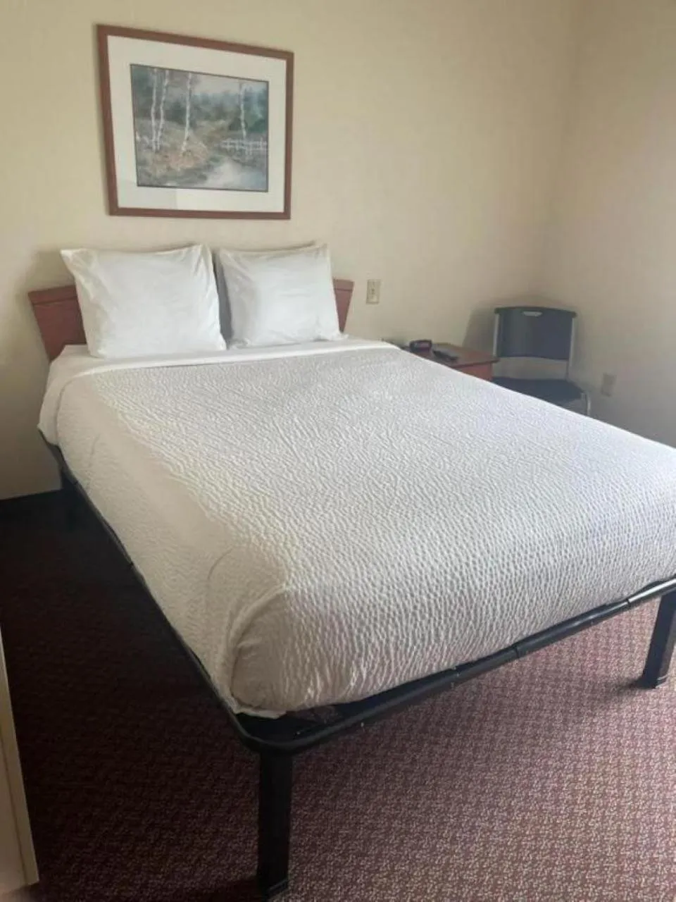 Bed in WoodSpring Suites Council Bluffs