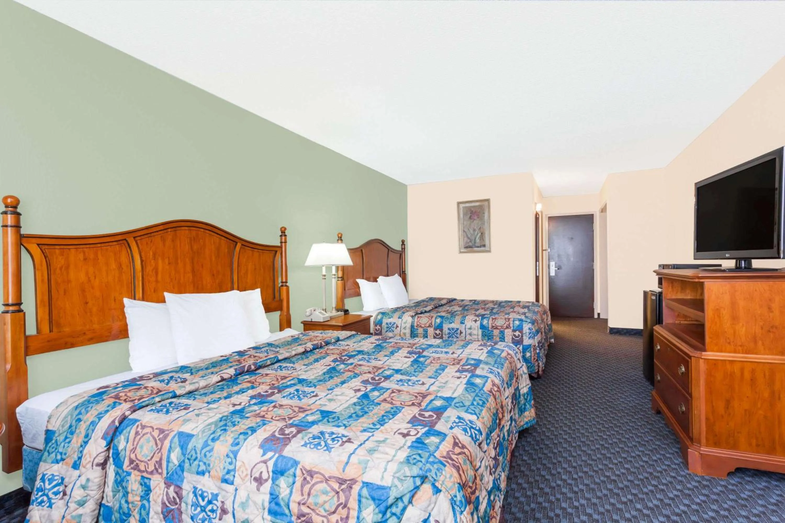 Photo of the whole room in Days Inn & Suites by Wyndham SE Columbia Ft Jackson