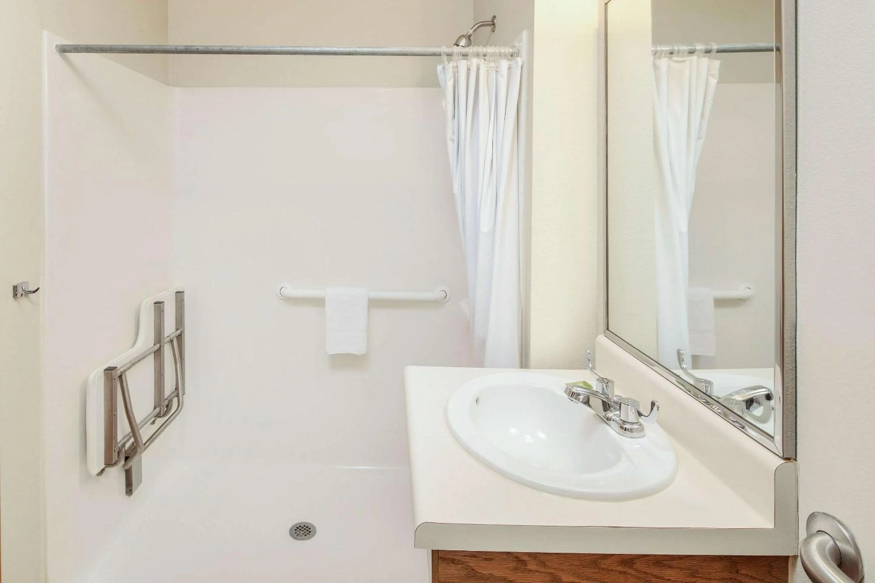 Bathroom in WoodSpring Suites Raleigh Apex