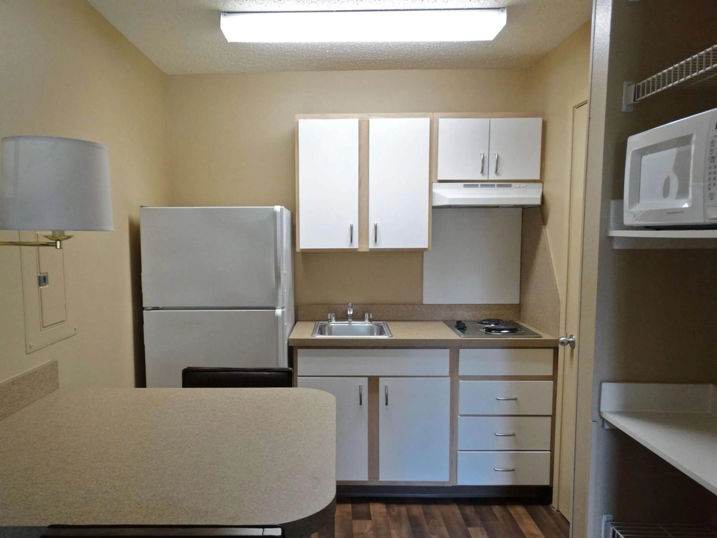 Kitchen or kitchenette, Kitchen/Kitchenette in Extended Stay America Suites - Raleigh - North Raleigh - Wake Forest Road