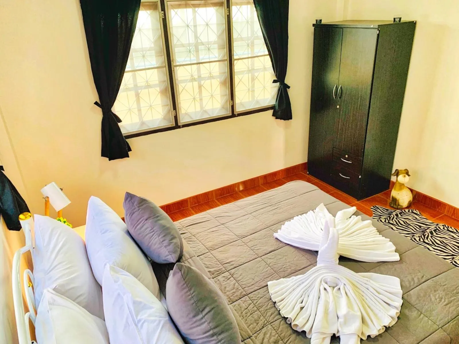 Bed in Thai Orange Villas