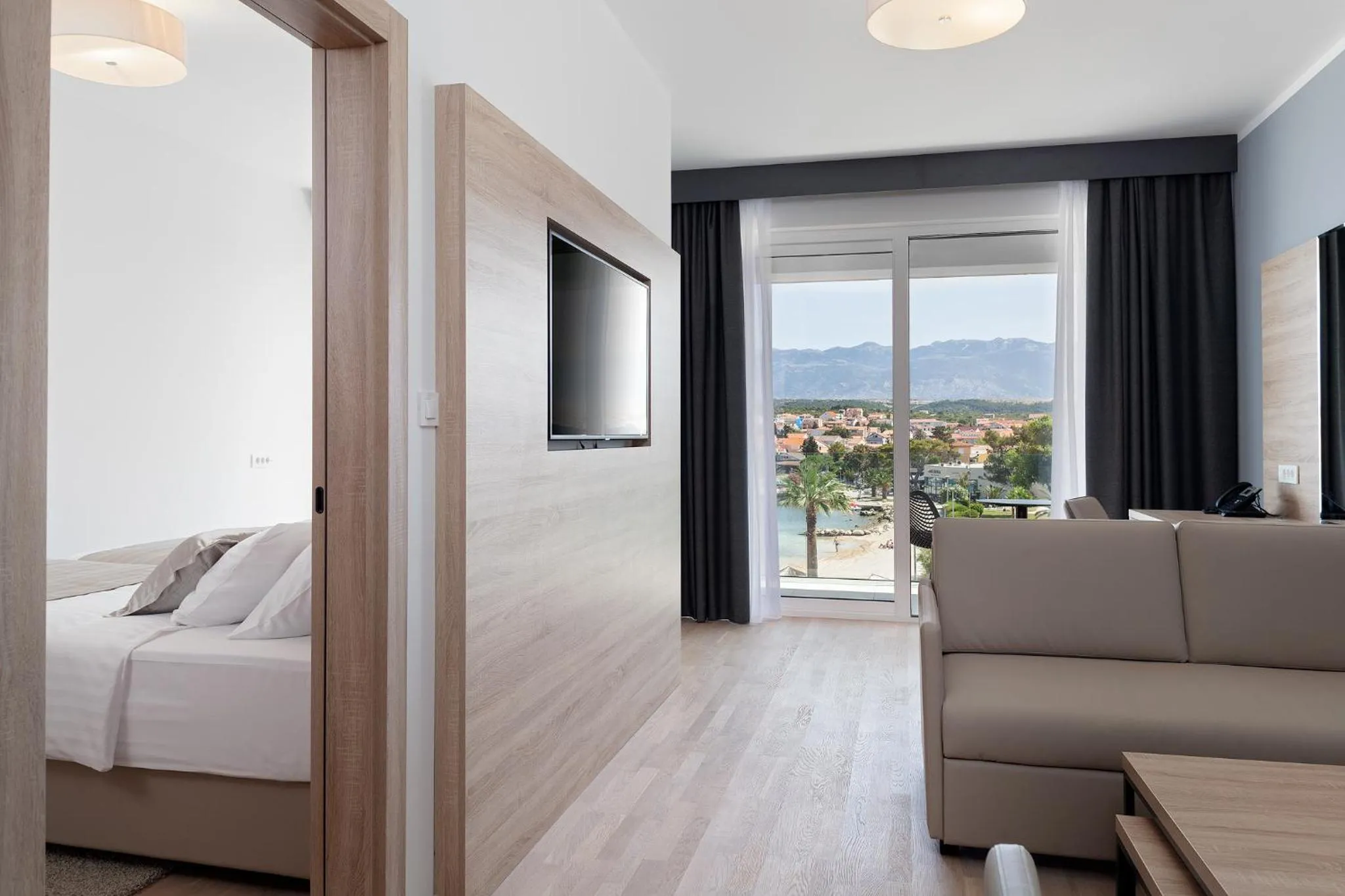 Living room, Bed in Kaneo beach hotel Novalja