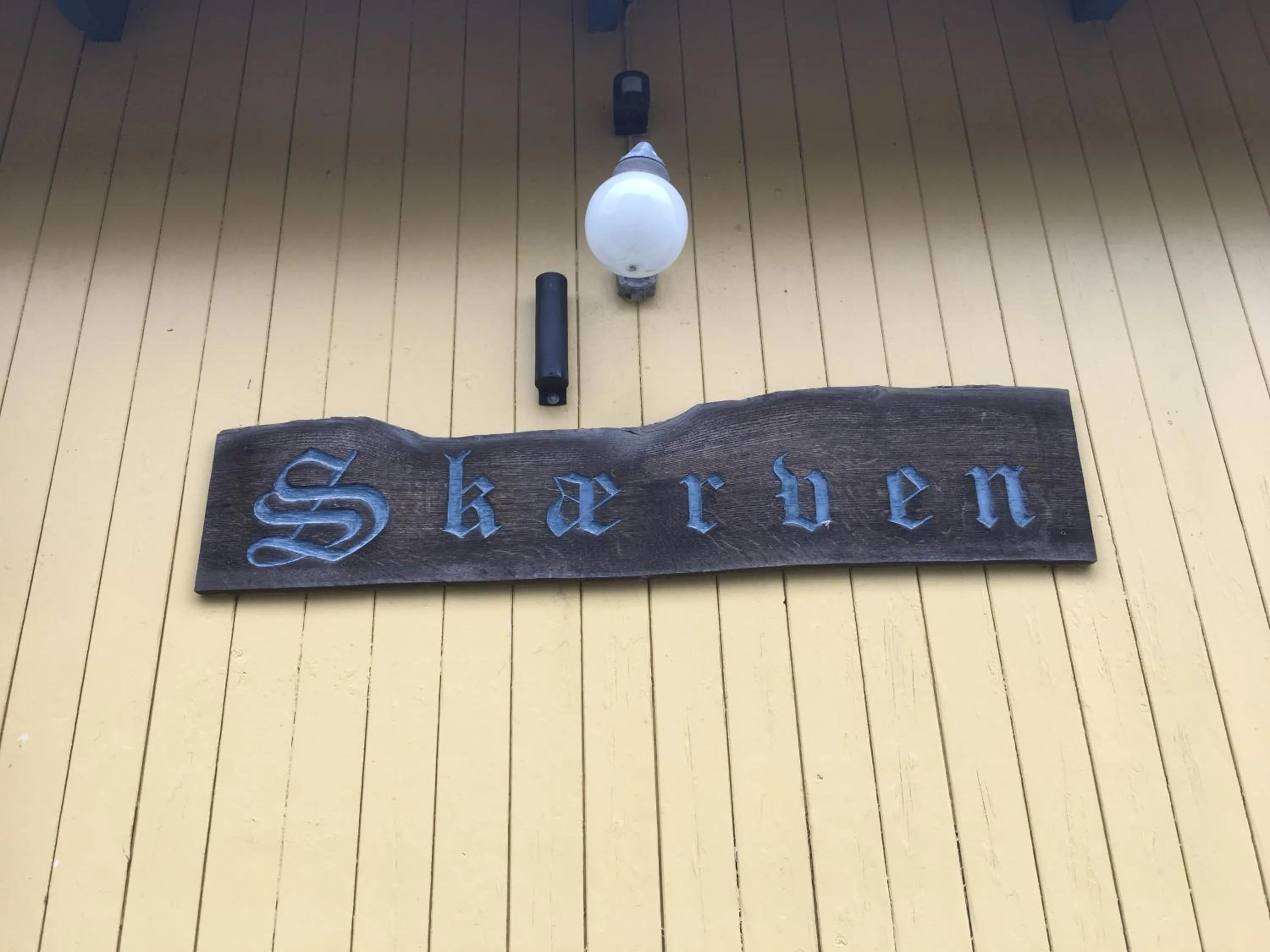 Property logo or sign in Skærven Beachfront Apartments and Cottage