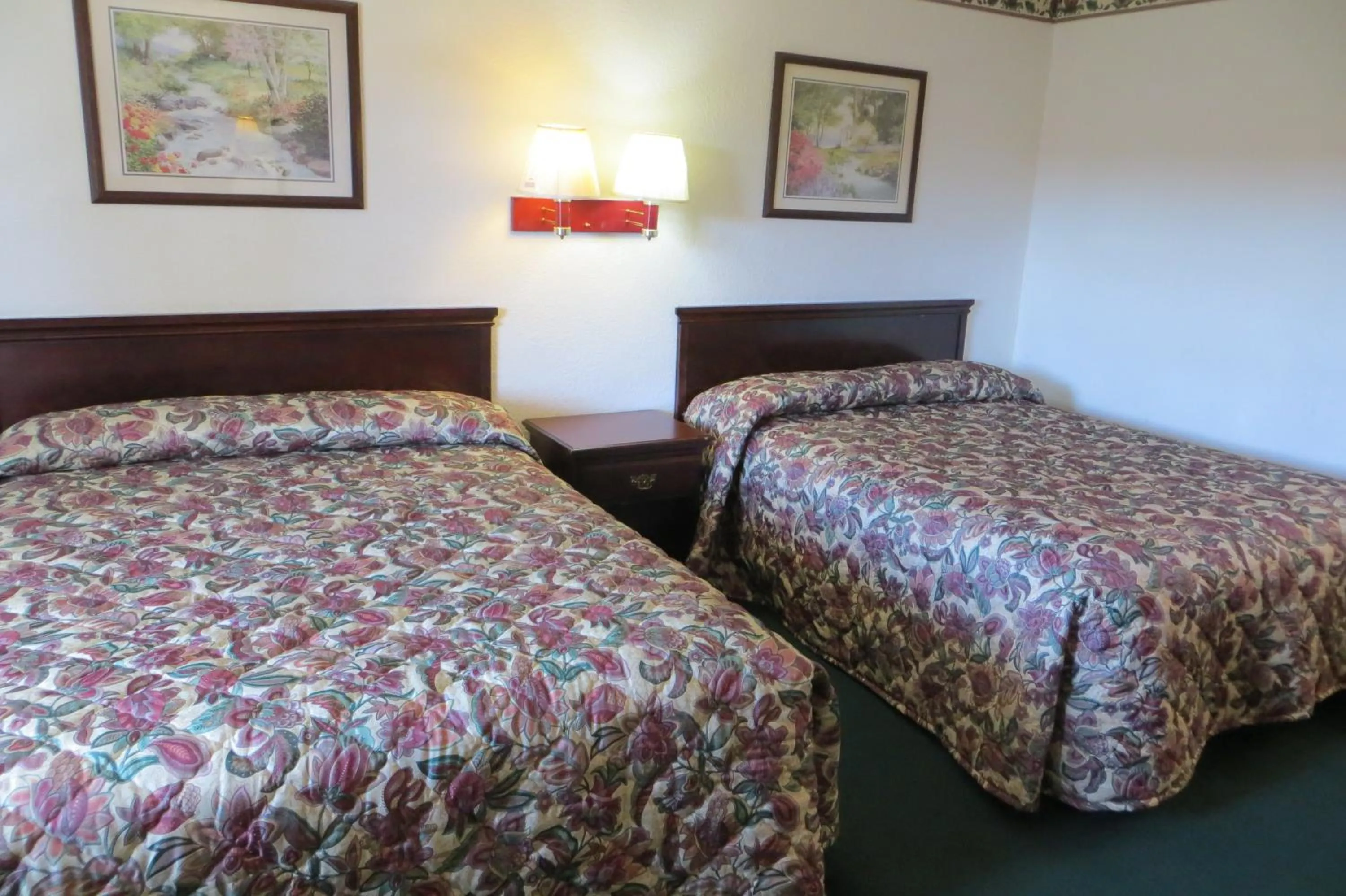 Bed in Capri Motel