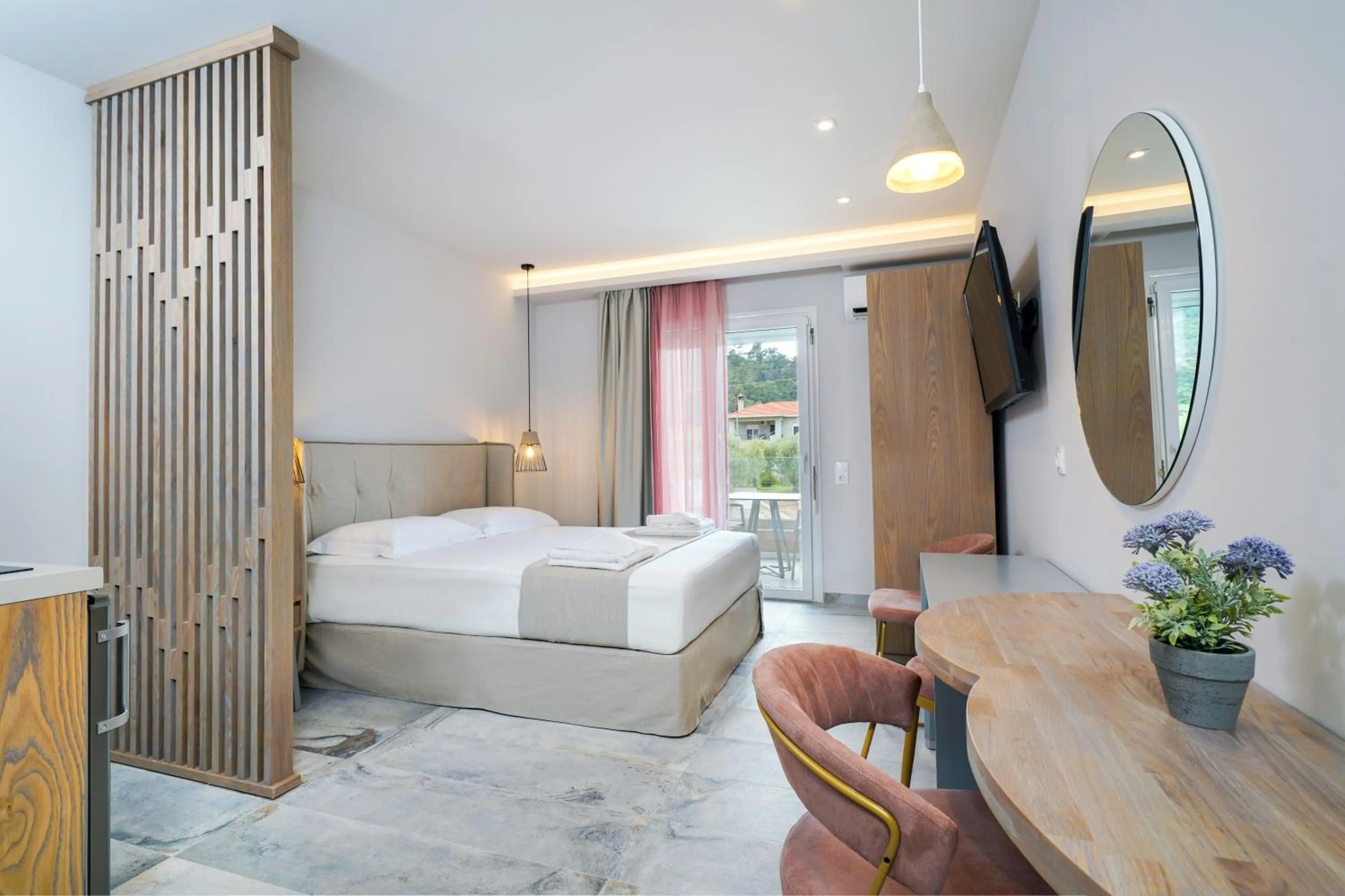 Photo of the whole room, Bed in Iliomagic Luxury Suites Thassos
