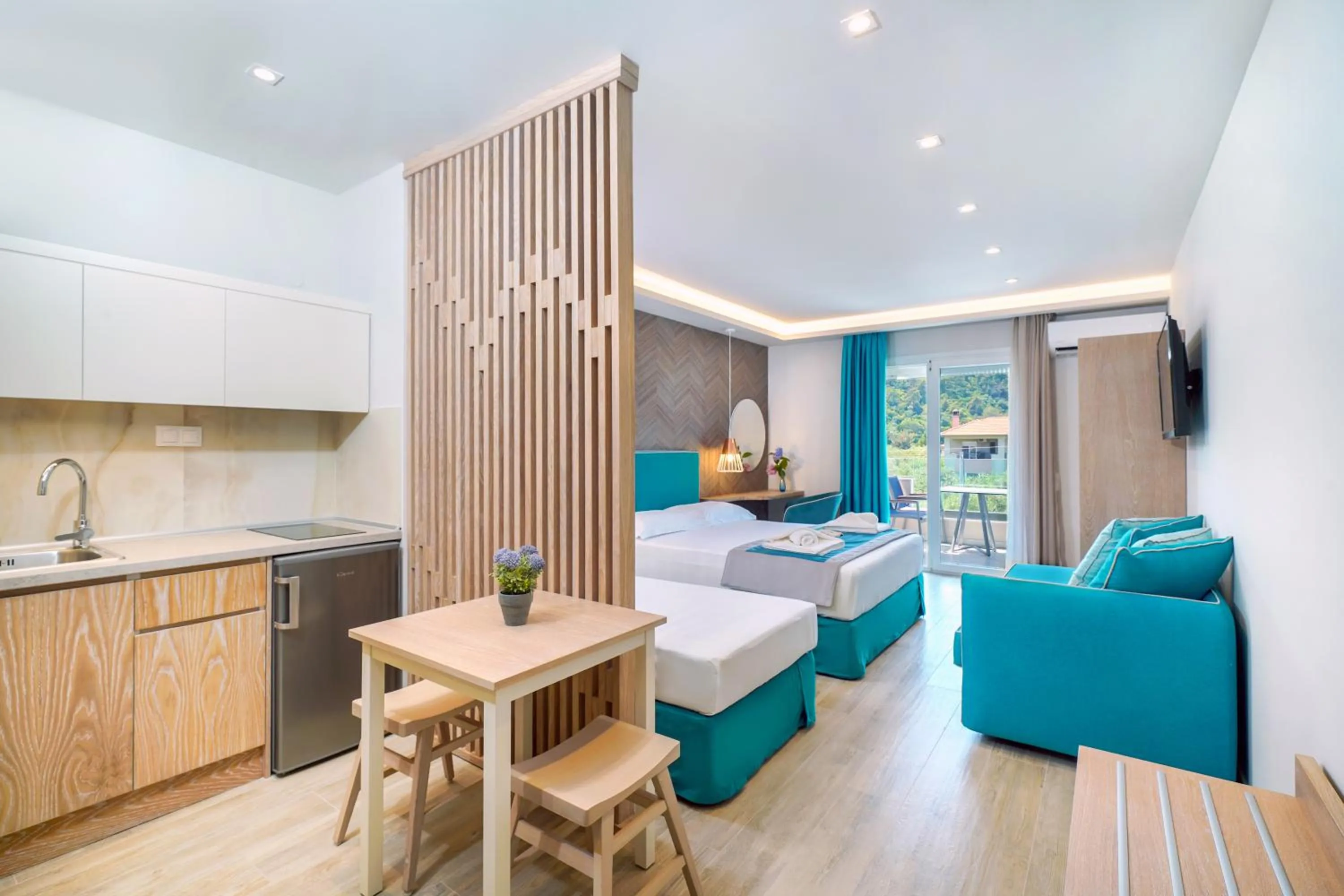 Photo of the whole room, Bed in Iliomagic Luxury Suites Thassos