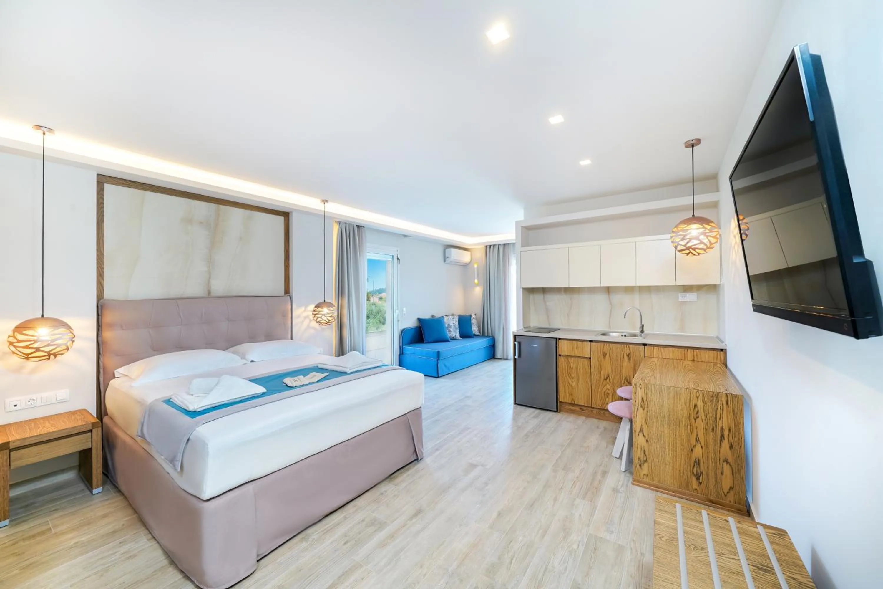 Photo of the whole room, Bed in Iliomagic Luxury Suites Thassos