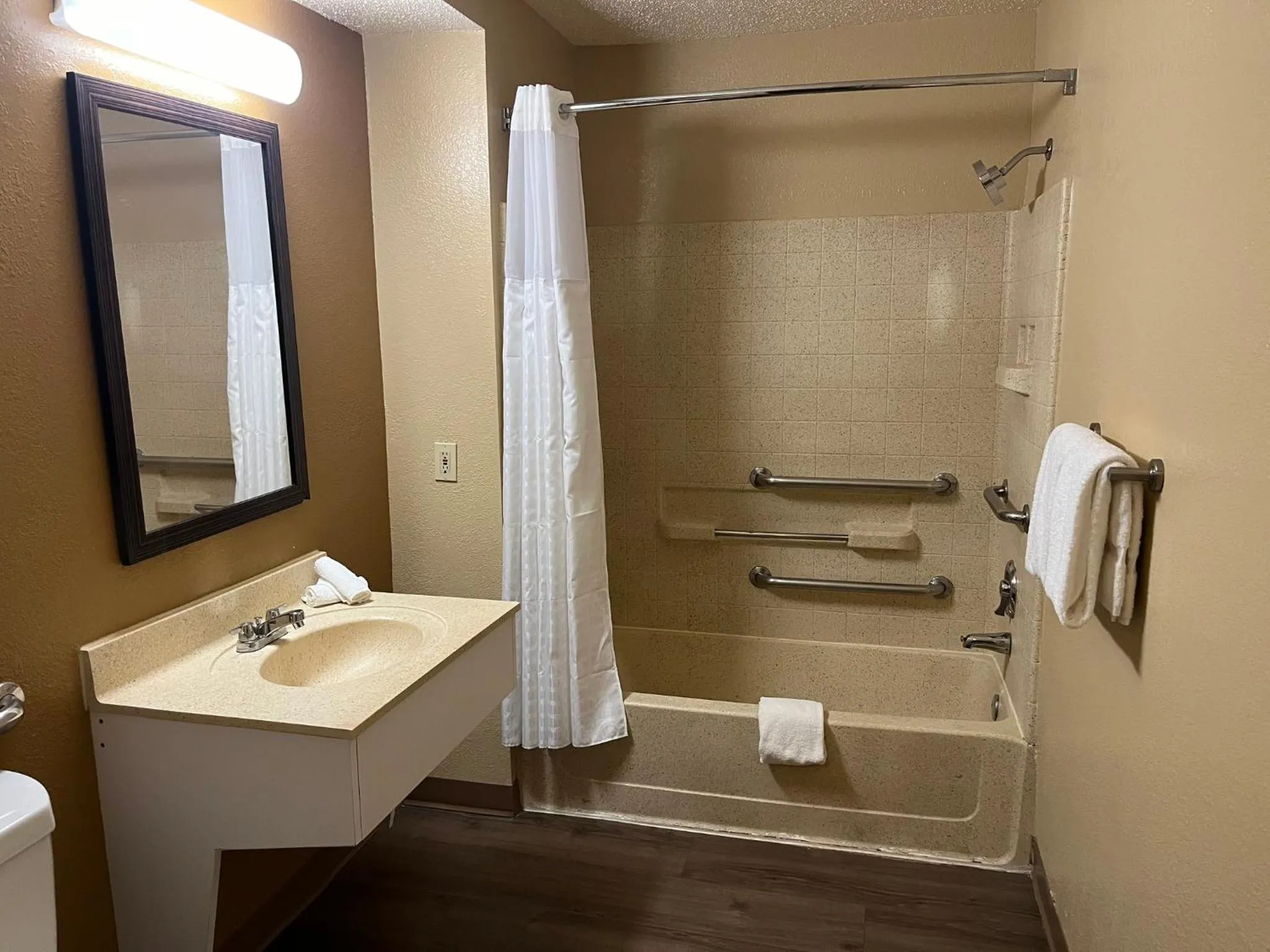 Bathroom in HomeTowne Studios & Suites by Red Roof Greensboro