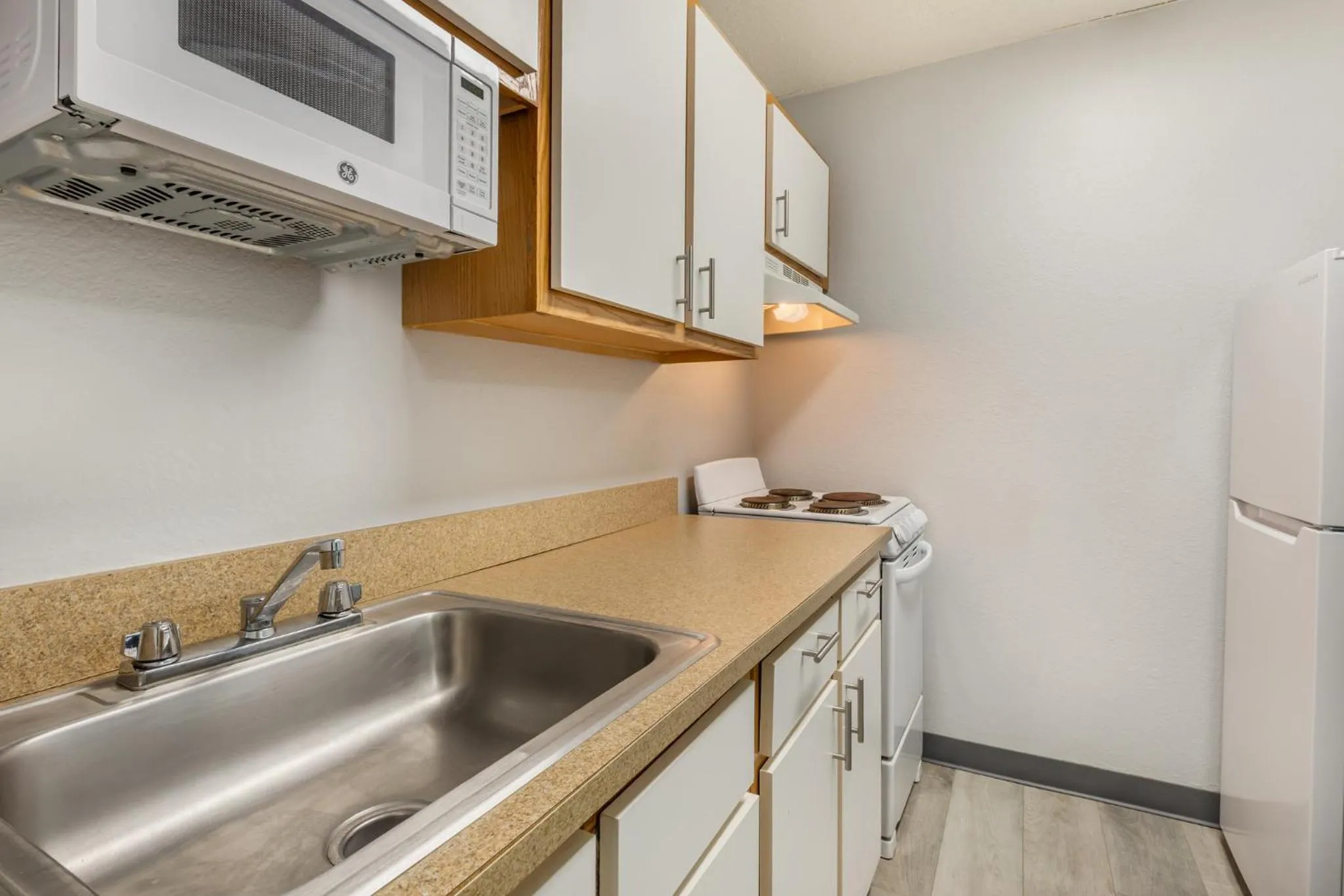 Kitchen or kitchenette in HomeTowne Studios & Suites by Red Roof Greensboro