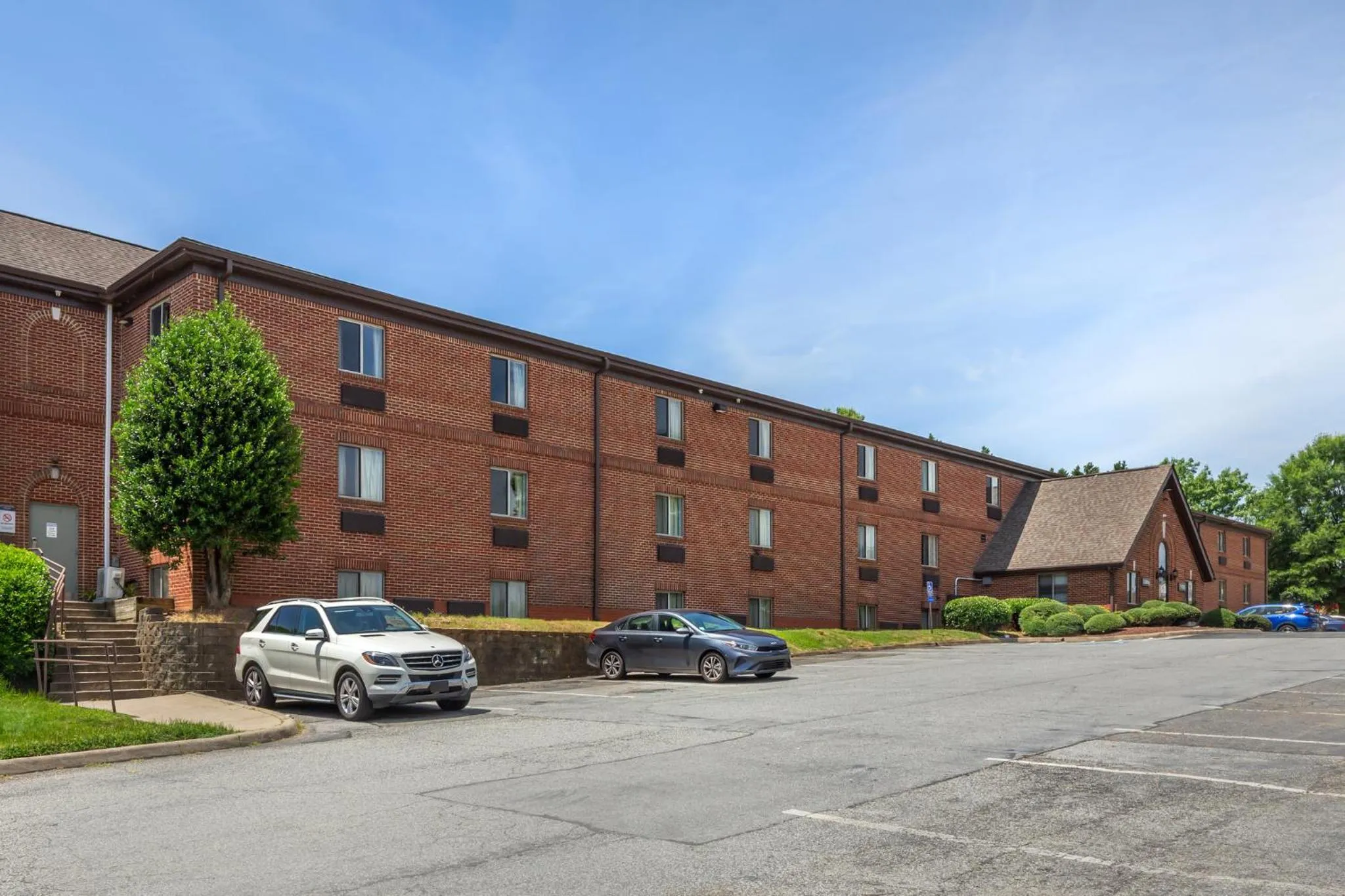 Property building in HomeTowne Studios & Suites by Red Roof Greensboro