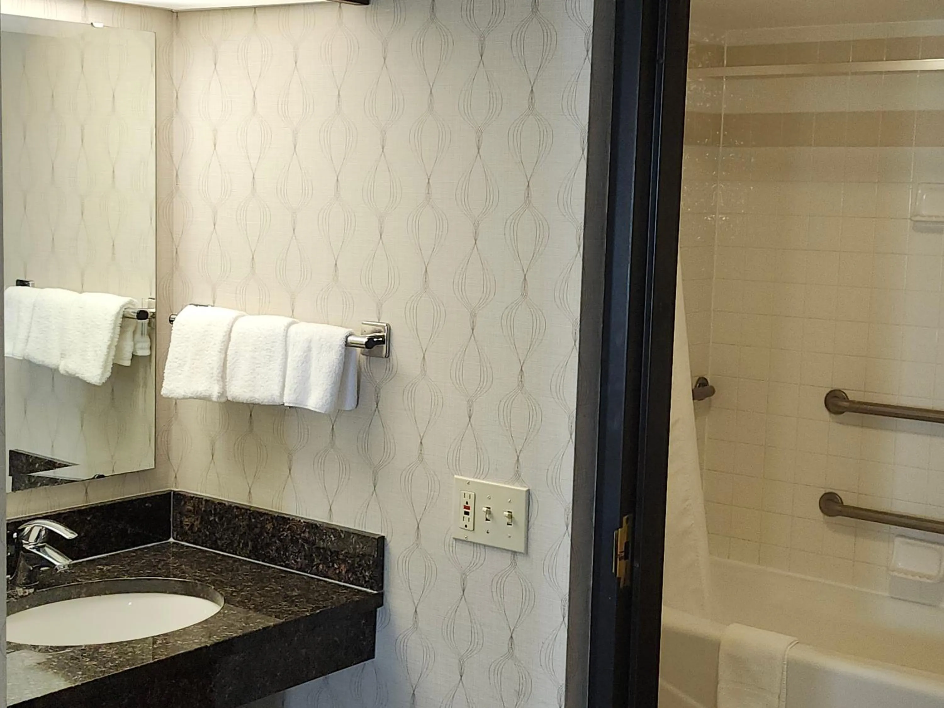 Bathroom in Heritage Inn Suites Houston Sugar Land, Trademark by Wyndham