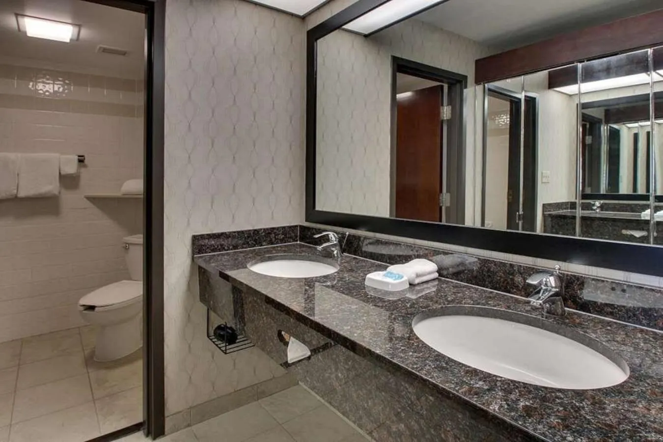 Bathroom in Heritage Inn Suites Houston Sugar Land, Trademark by Wyndham