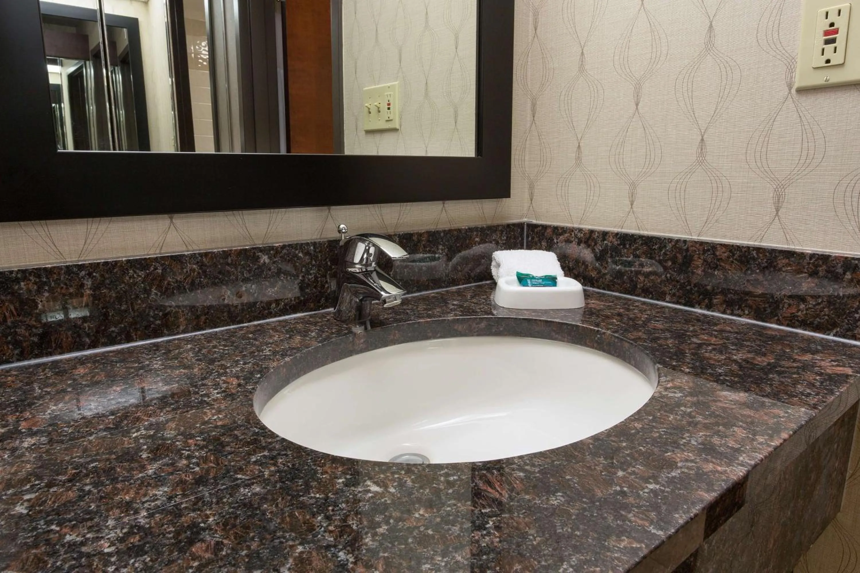 Bathroom in Heritage Inn Suites Houston Sugar Land, Trademark by Wyndham