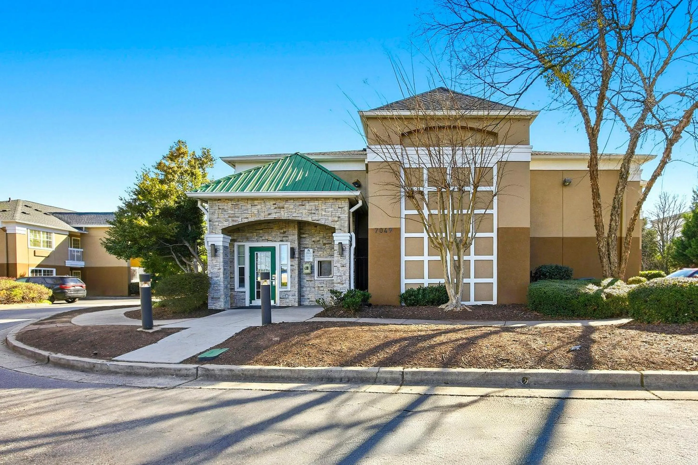 Property building in HomeTowne Studios by Red Roof Atlanta - Peachtree Corners