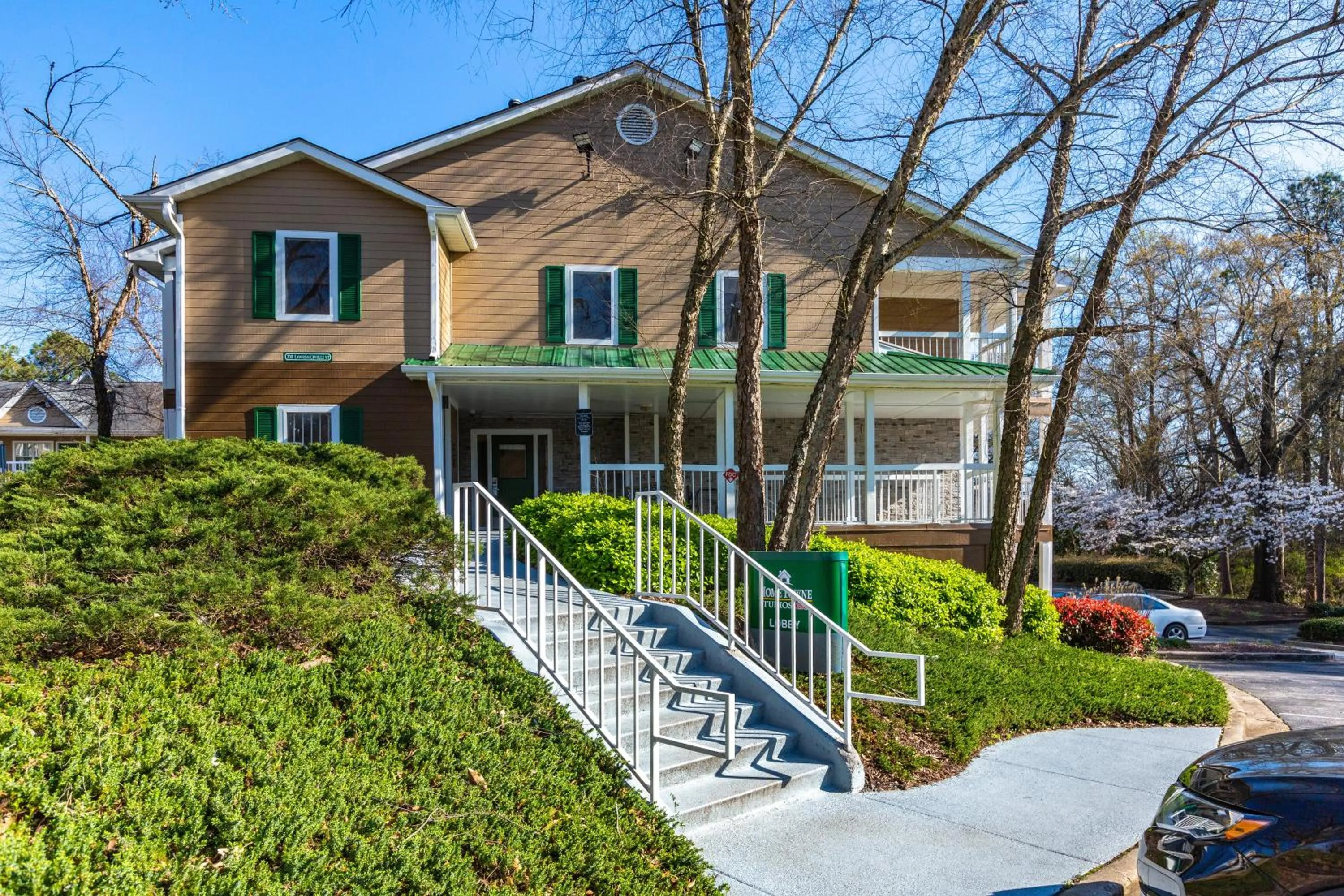 Property building in HomeTowne Studios by Red Roof Atlanta NE - Downtown Norcross