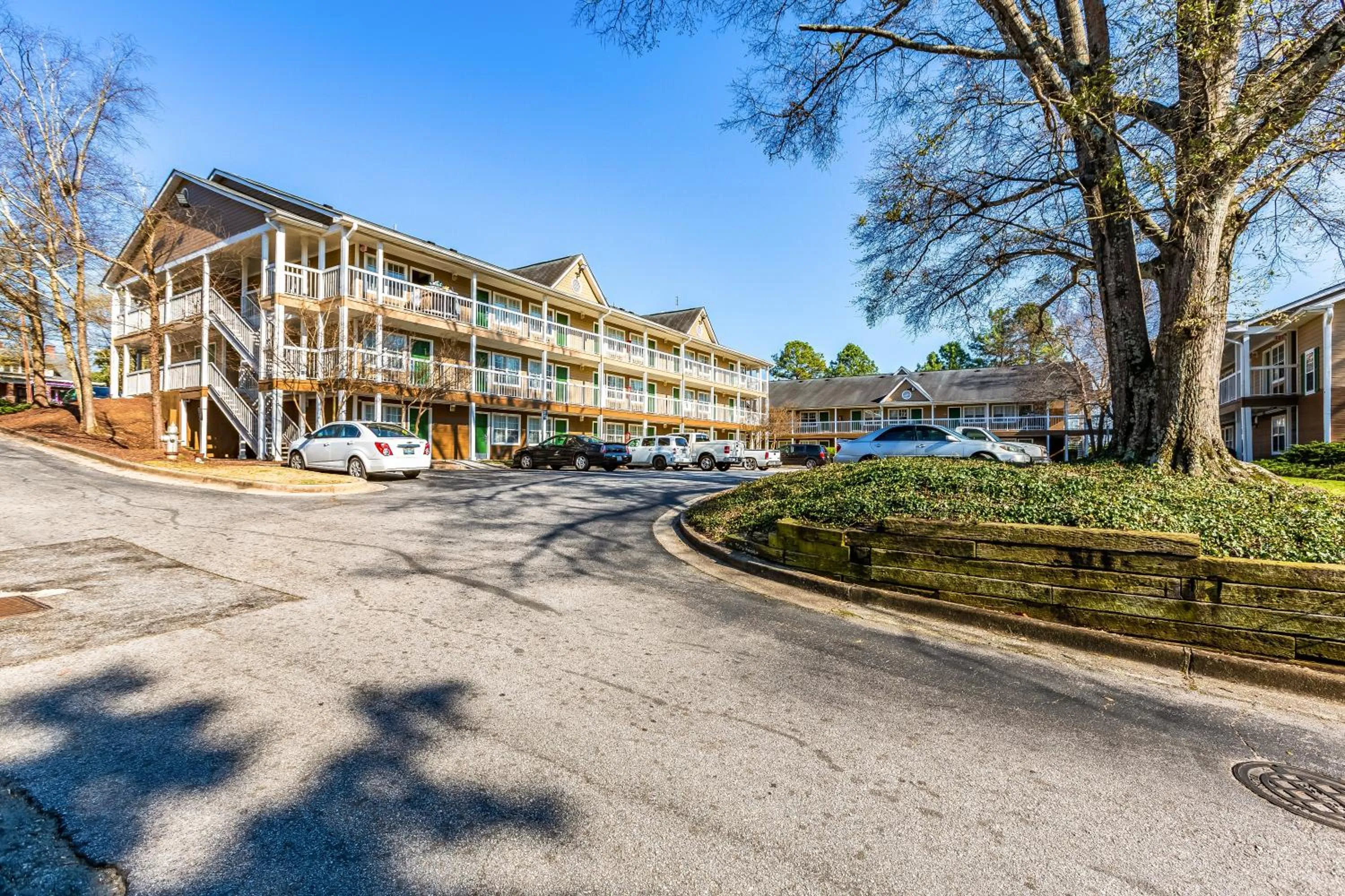 Property building in HomeTowne Studios by Red Roof Atlanta NE - Downtown Norcross