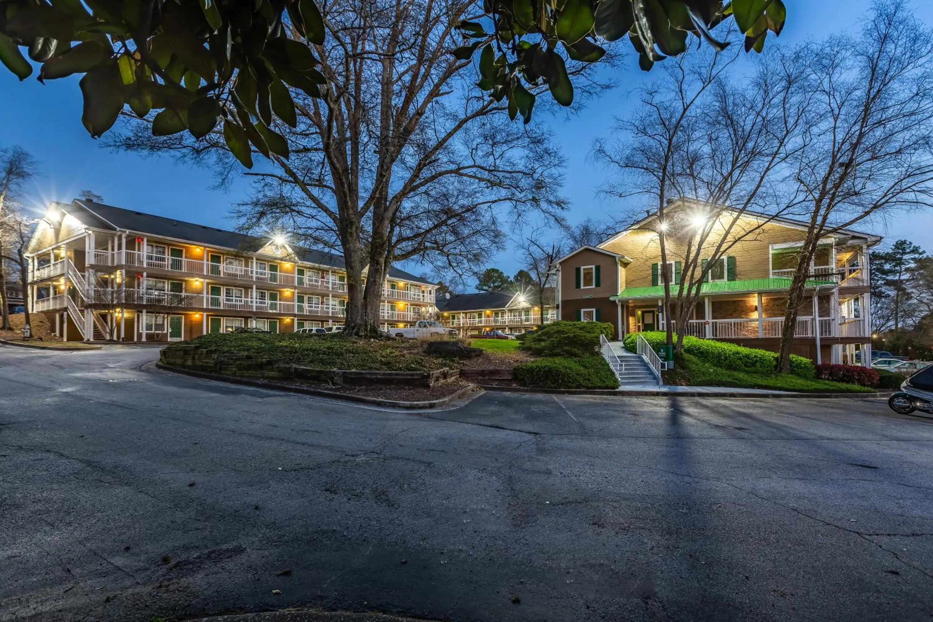 Property building in HomeTowne Studios by Red Roof Atlanta NE - Downtown Norcross