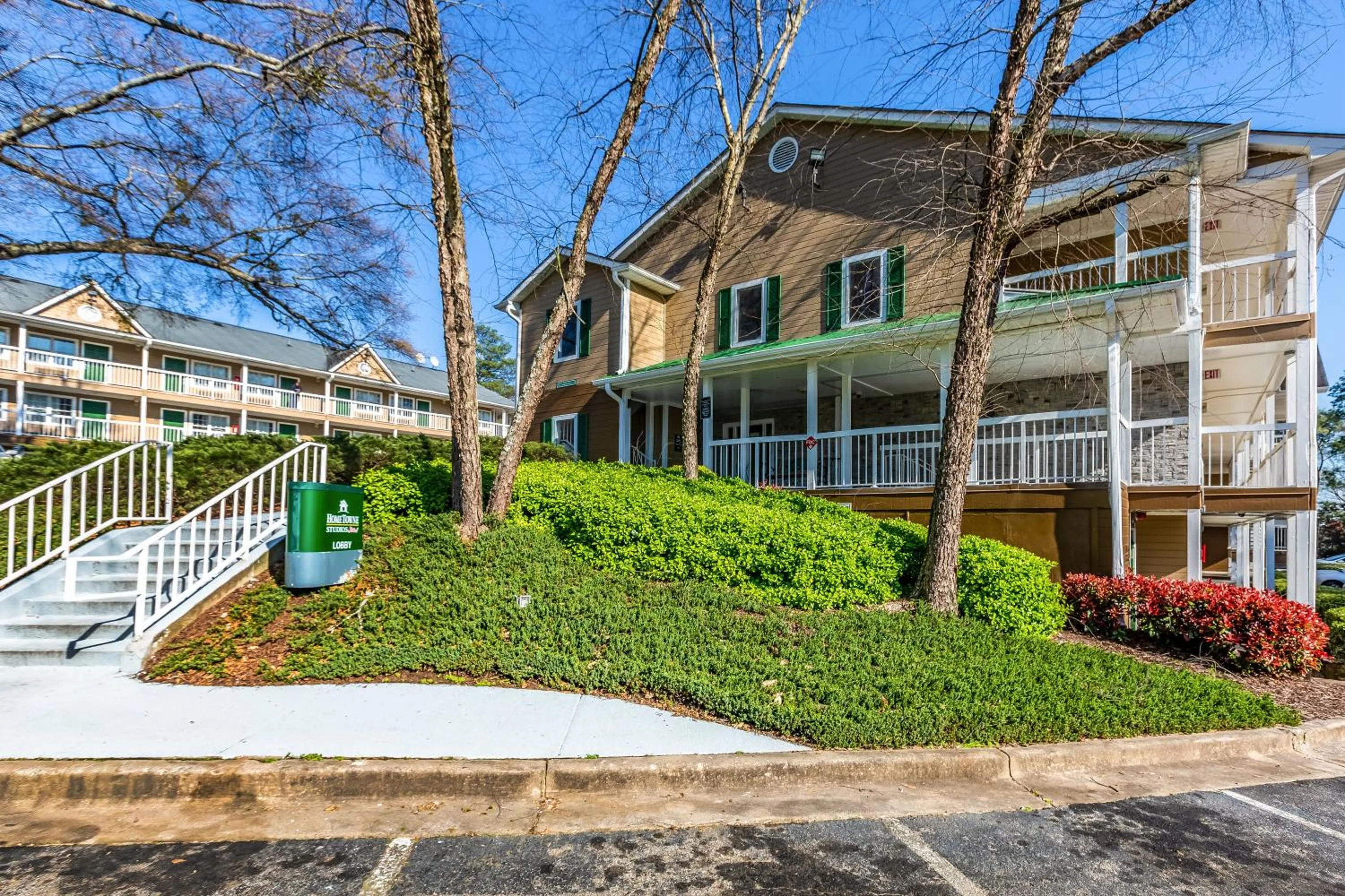 Property building in HomeTowne Studios by Red Roof Atlanta NE - Downtown Norcross
