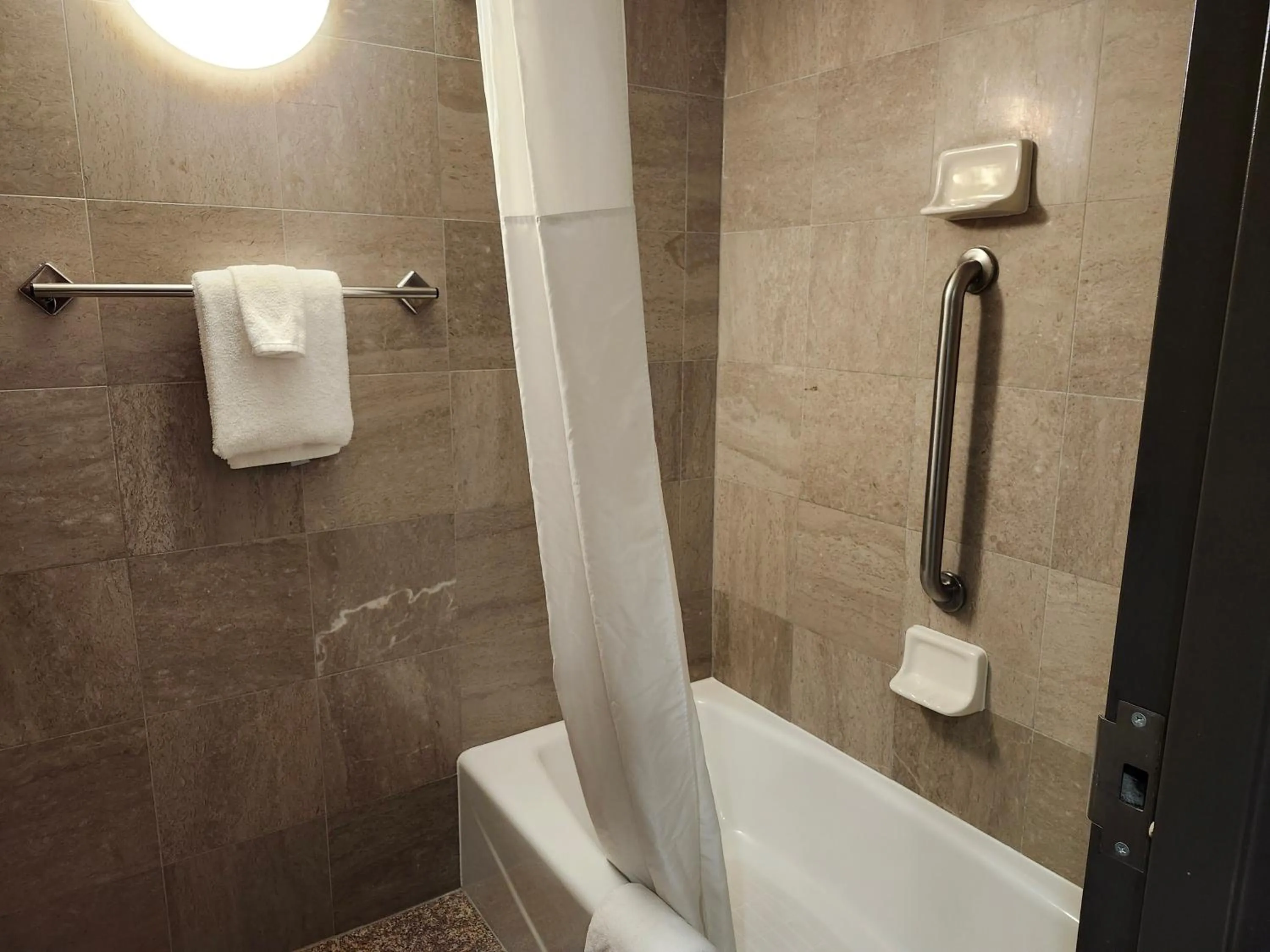 Bathroom in Heritage Inn & Suites St Louis Fenton, Trademark by Wyndham