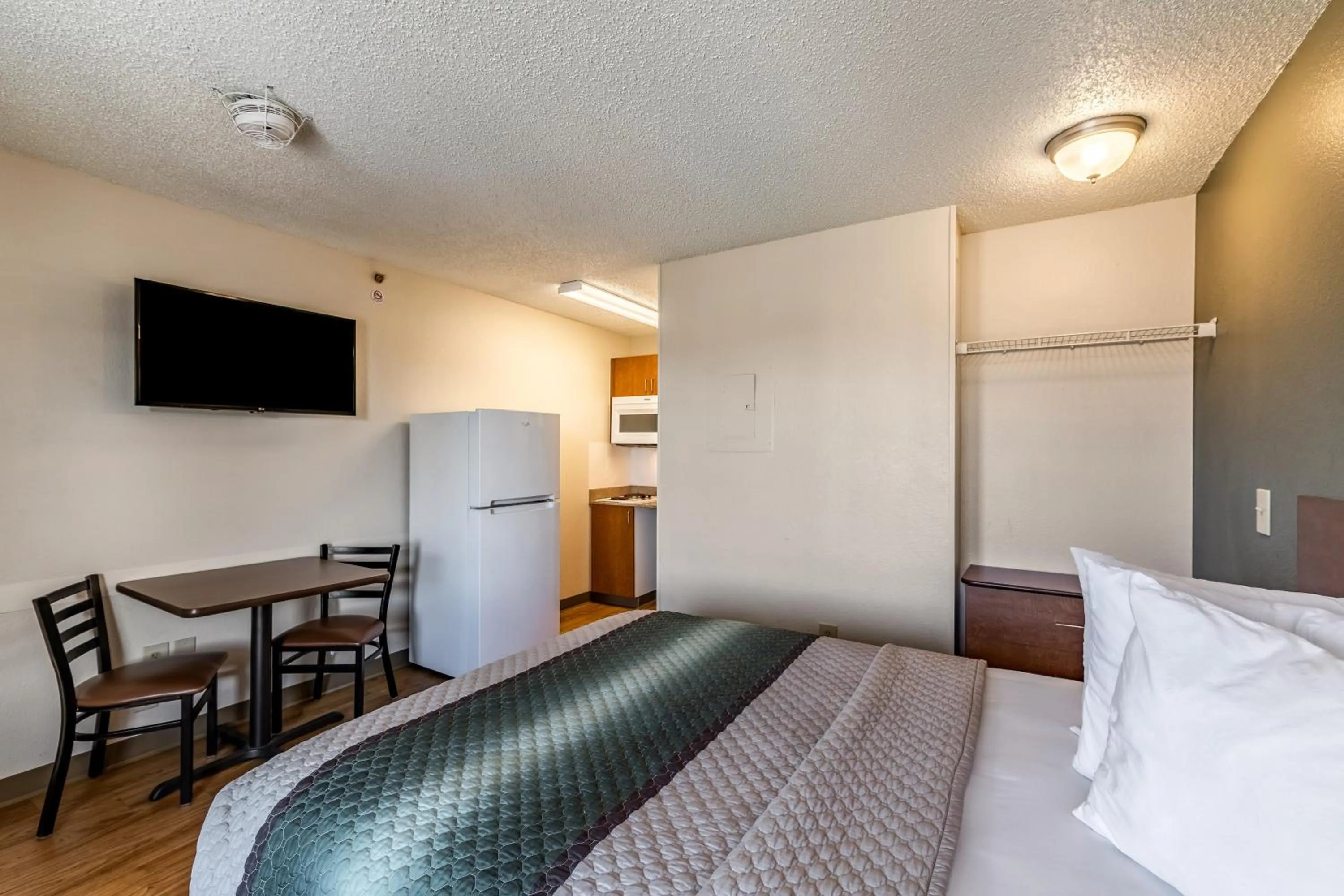 Photo of the whole room, Bed in HomeTowne Studios by Red Roof Austin