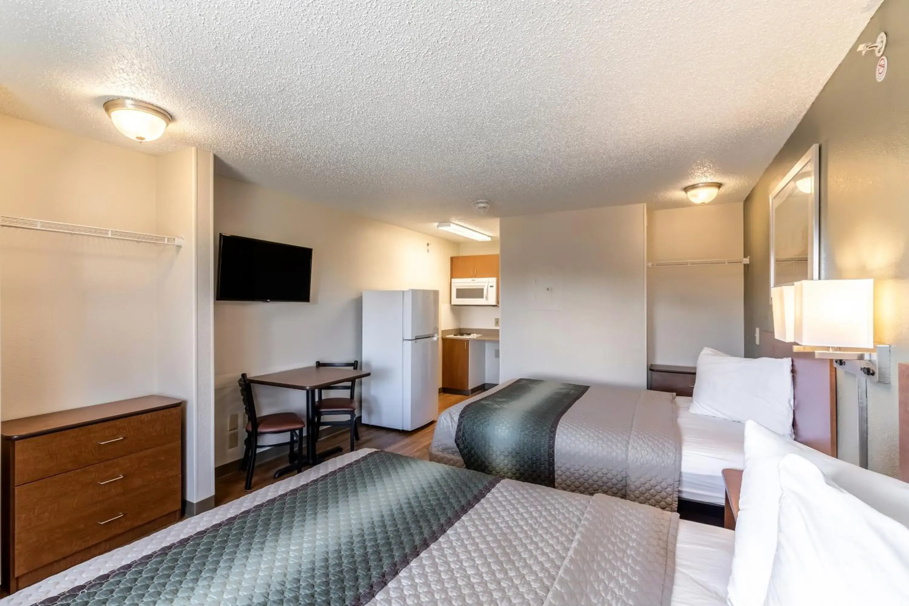 Photo of the whole room, Bed in HomeTowne Studios by Red Roof Austin Photo of the whole room, Bed in HomeTowne Studios by Red Roof Austin