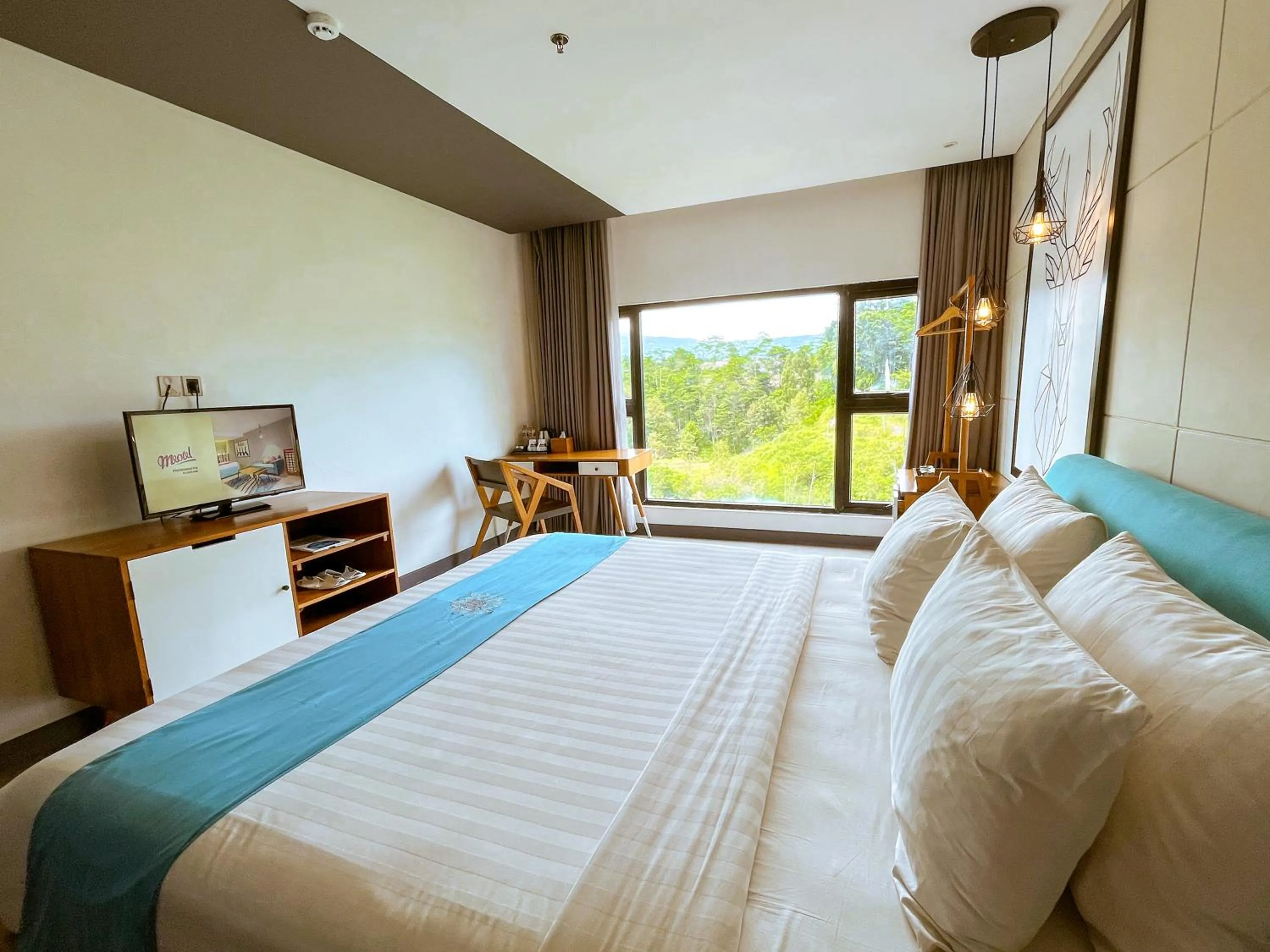 Bed in Hotel Dafam Wonosobo