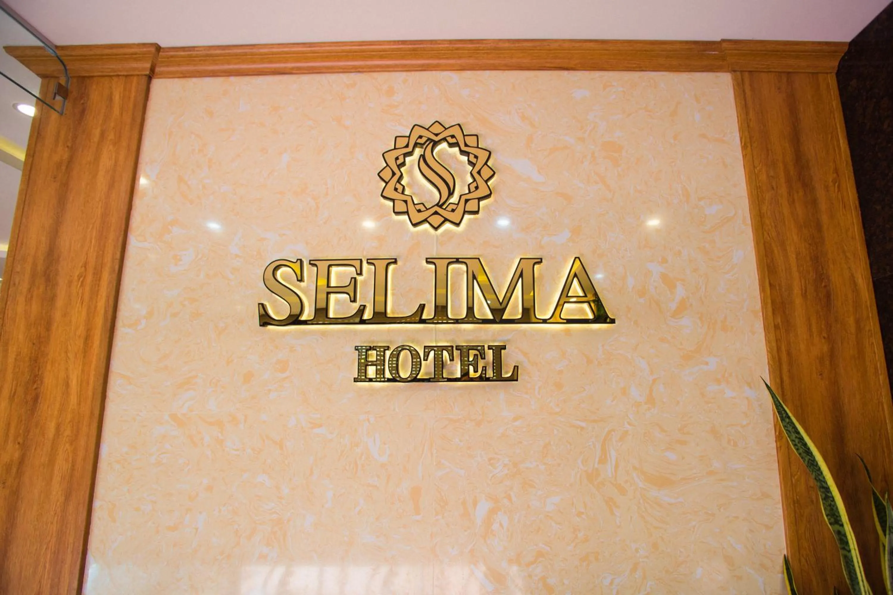 Property logo or sign in Selima Hotel
