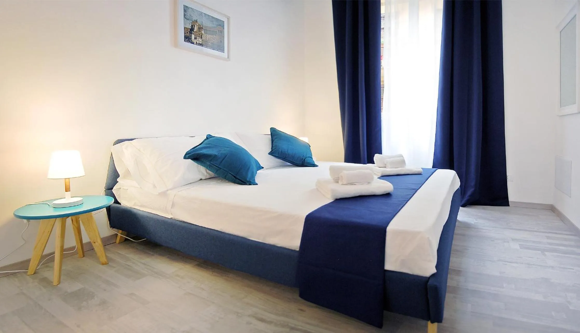 Bed in Pompeo Magno White Luxury Apartment
