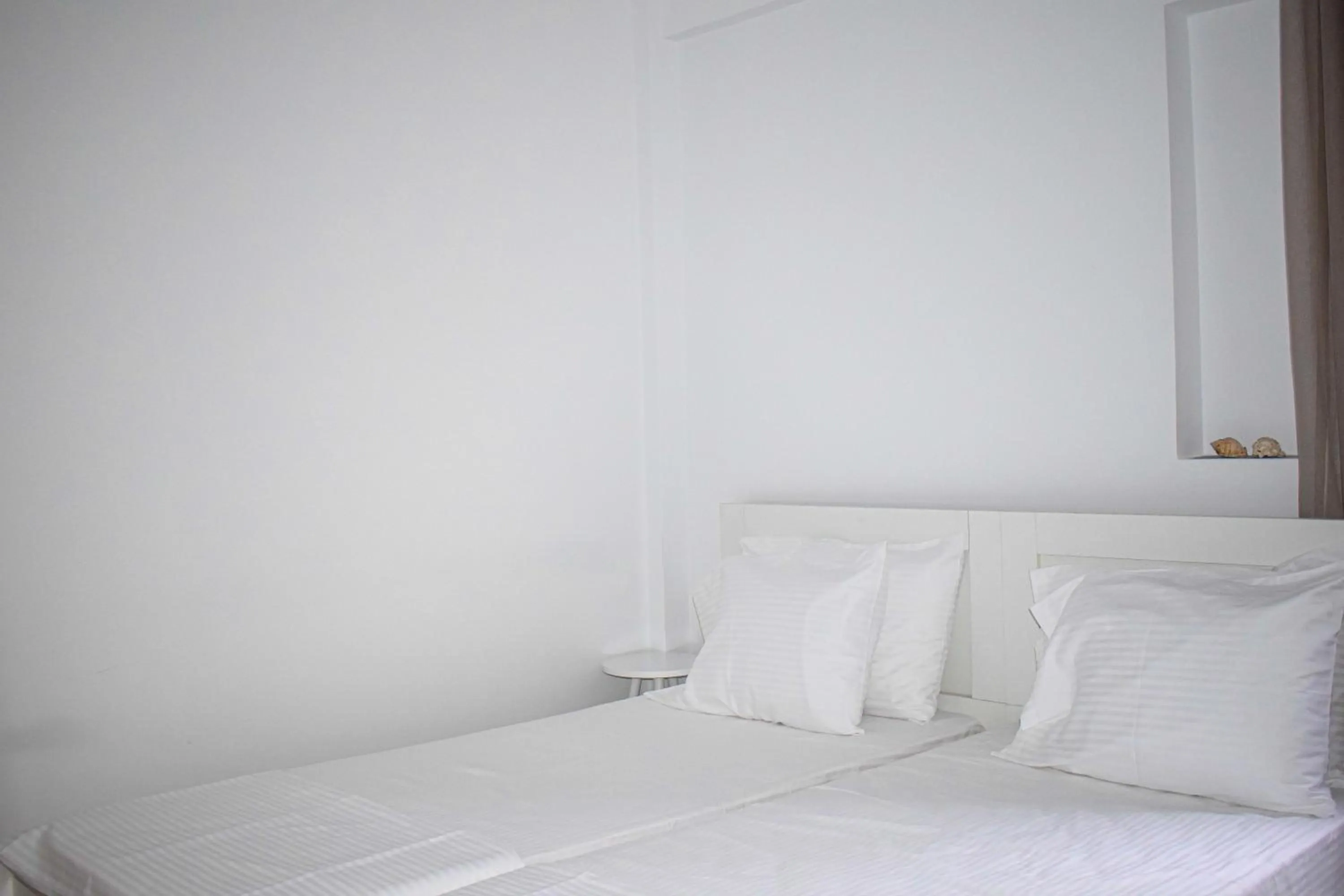 Bed in Muses seaside Villas