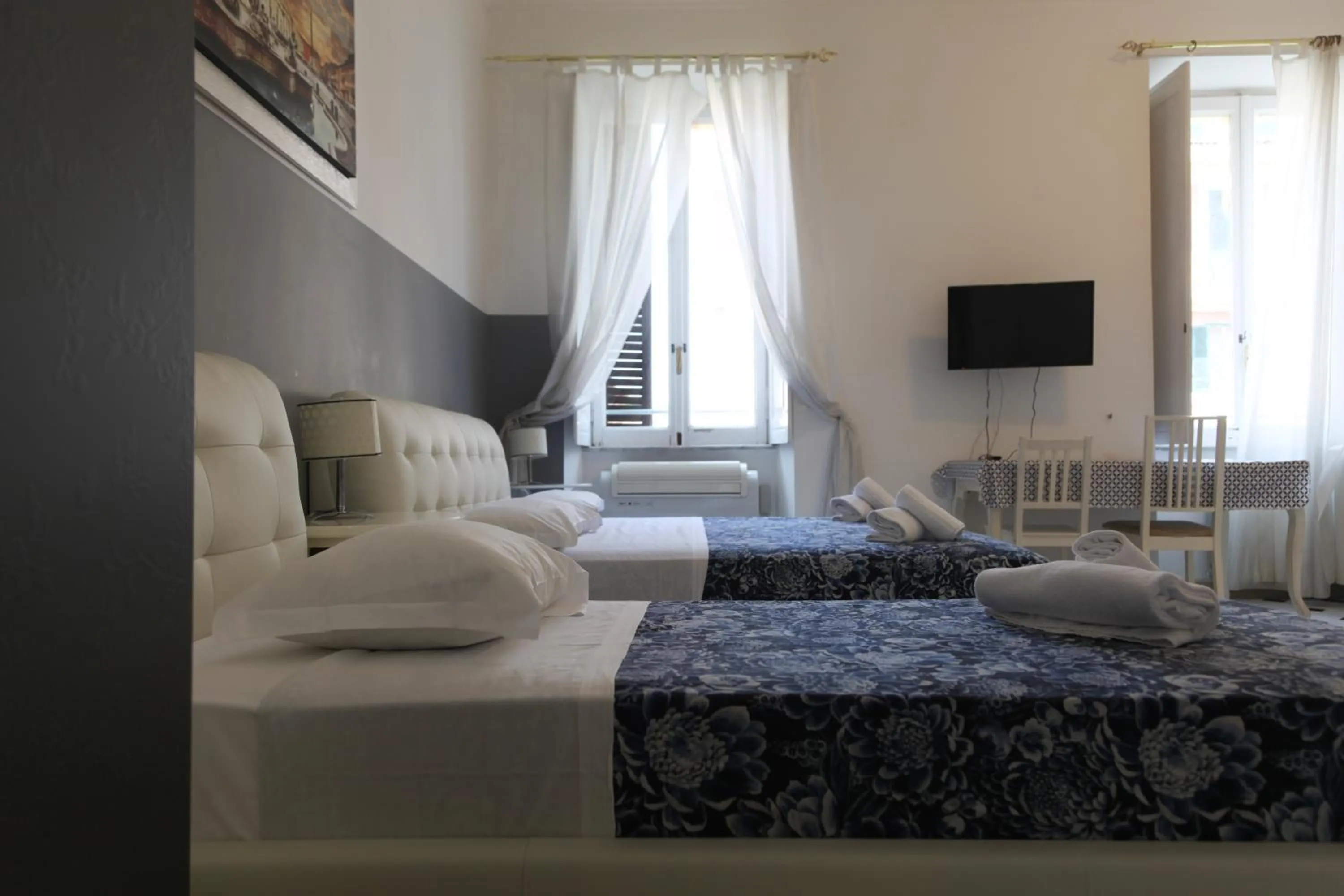 Photo of the whole room, Bed in Vatican Room and Kitchen