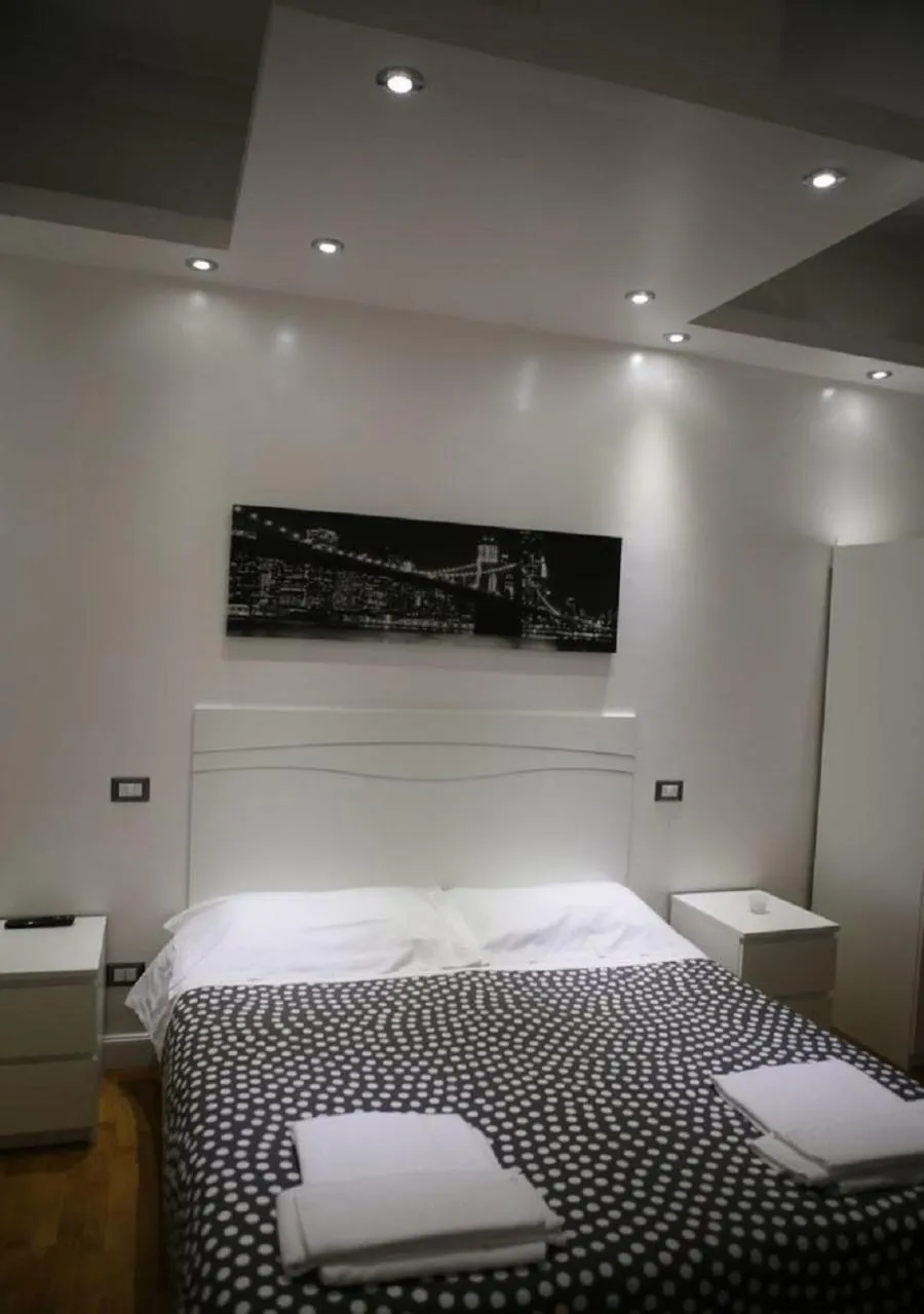 Photo of the whole room, Bed in Vatican Room and Kitchen