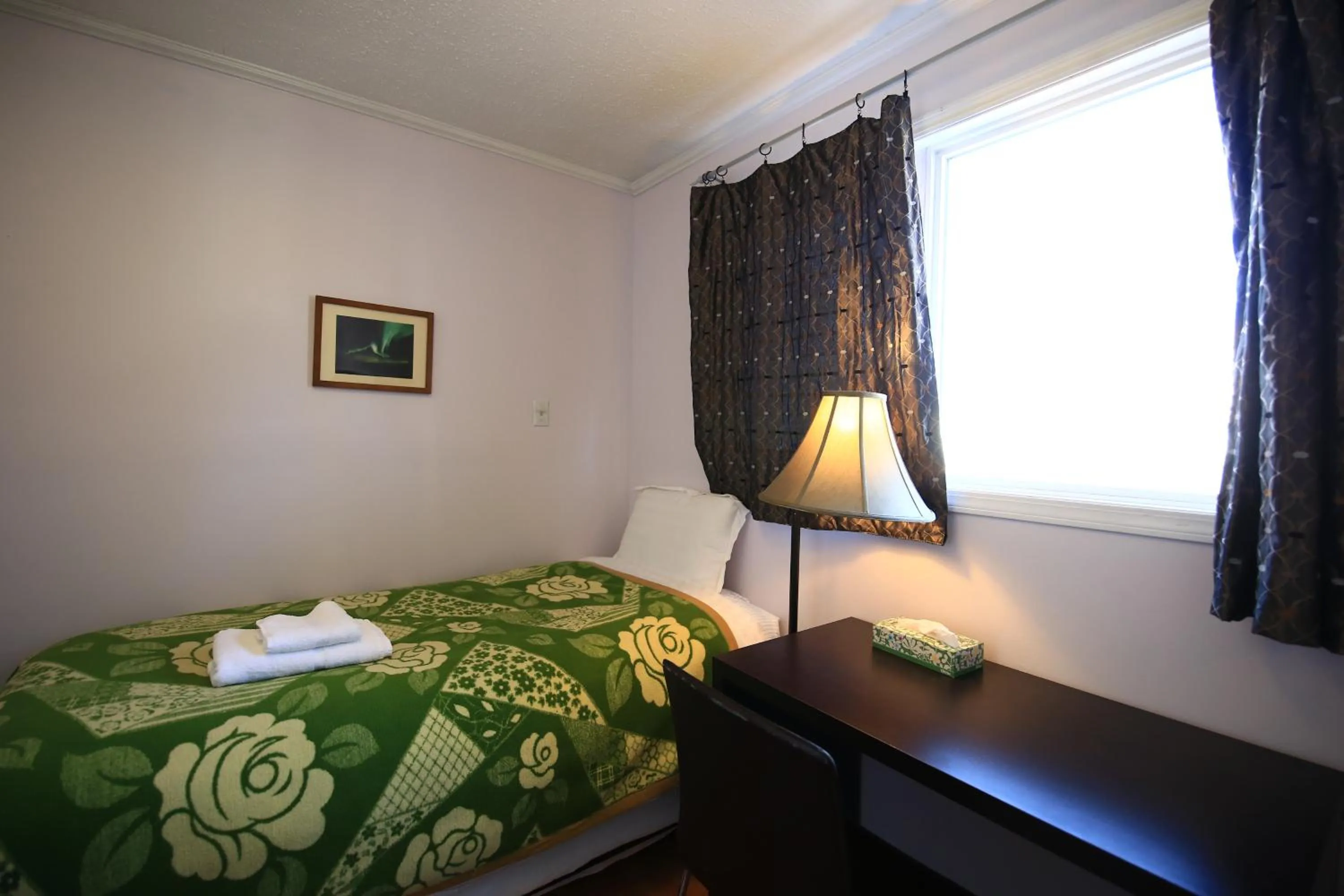 Bed in Jenny Guest House