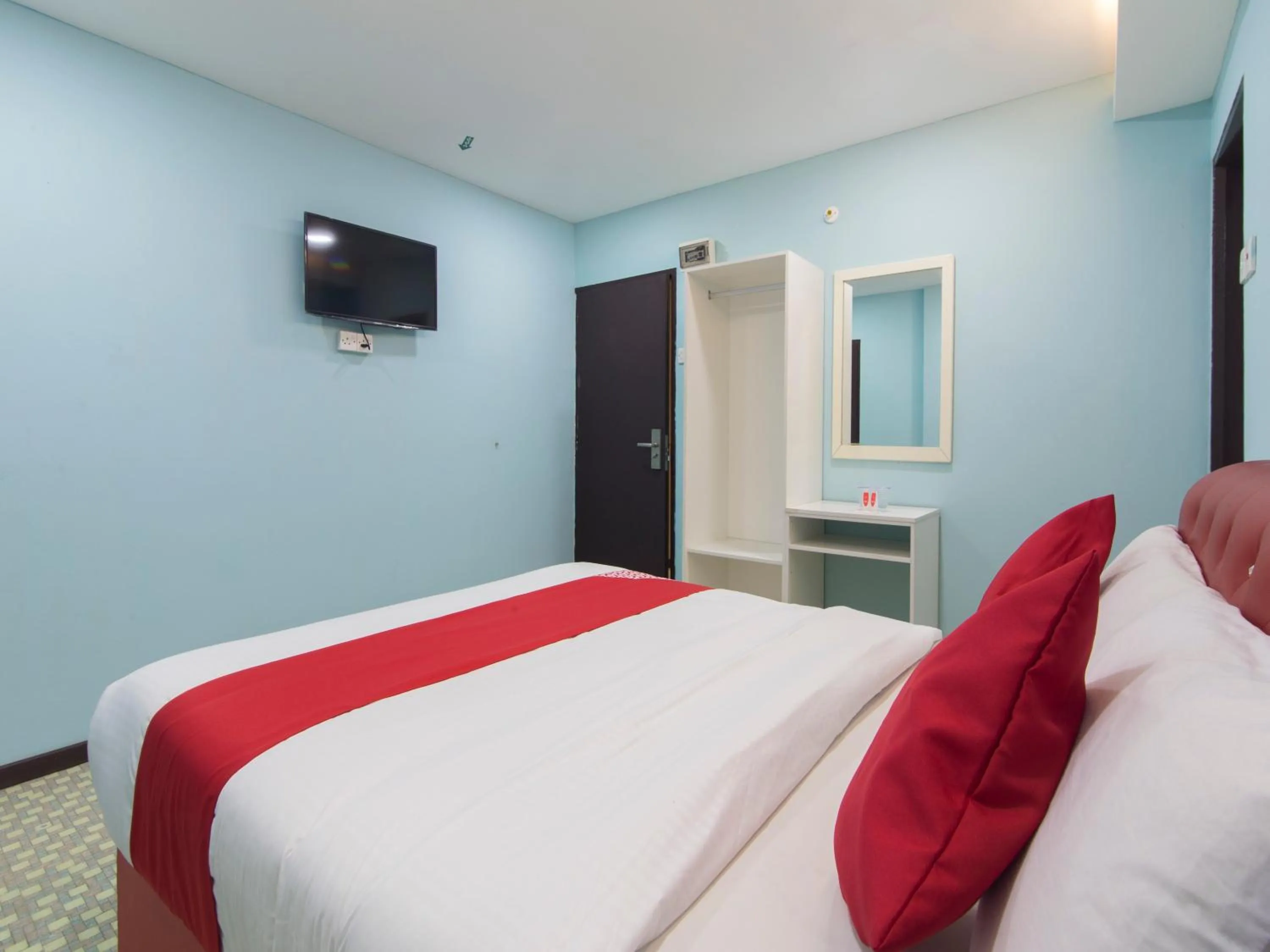 Bedroom in OYO 1136 Pd Star Hotel