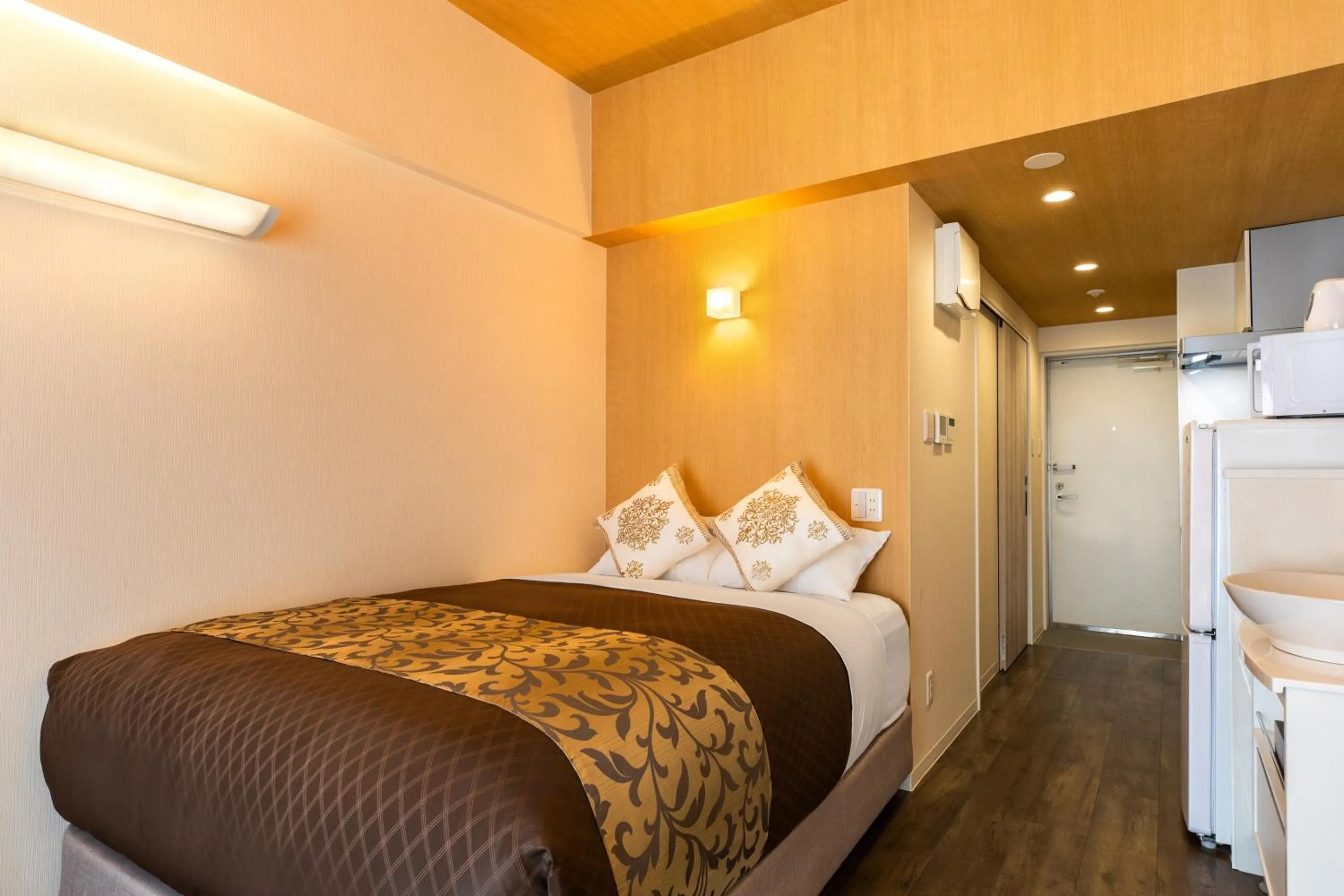 Bed in Mr.KINJO Beach Side Kafu-shi