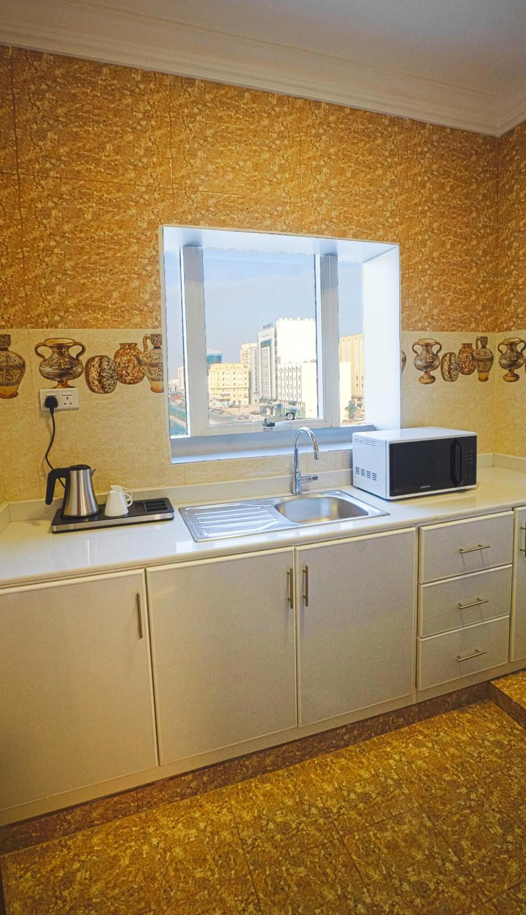 Kitchen or kitchenette in Salalah Royal Hotel Suites