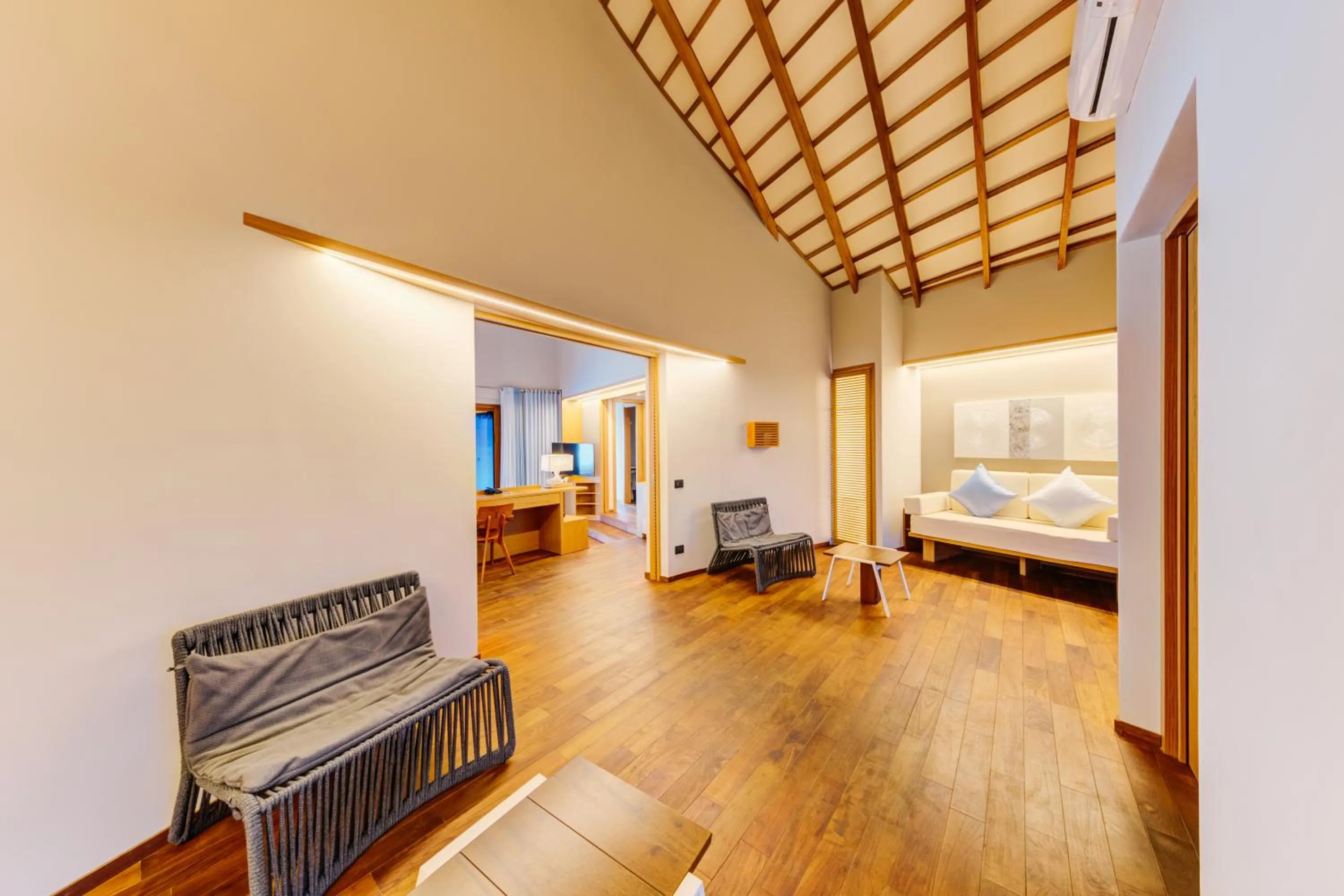 Seating area, Bed in Cinnamon Velifushi Maldives - Free One-Way Speedboat and 02 Kids Under 12 Stay & Dine Free