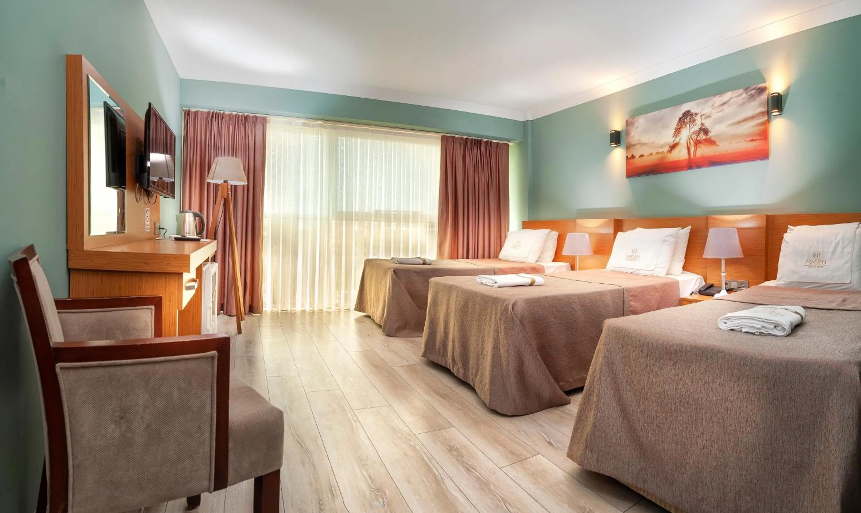 Bed in MARINN DELUXE HOTEL