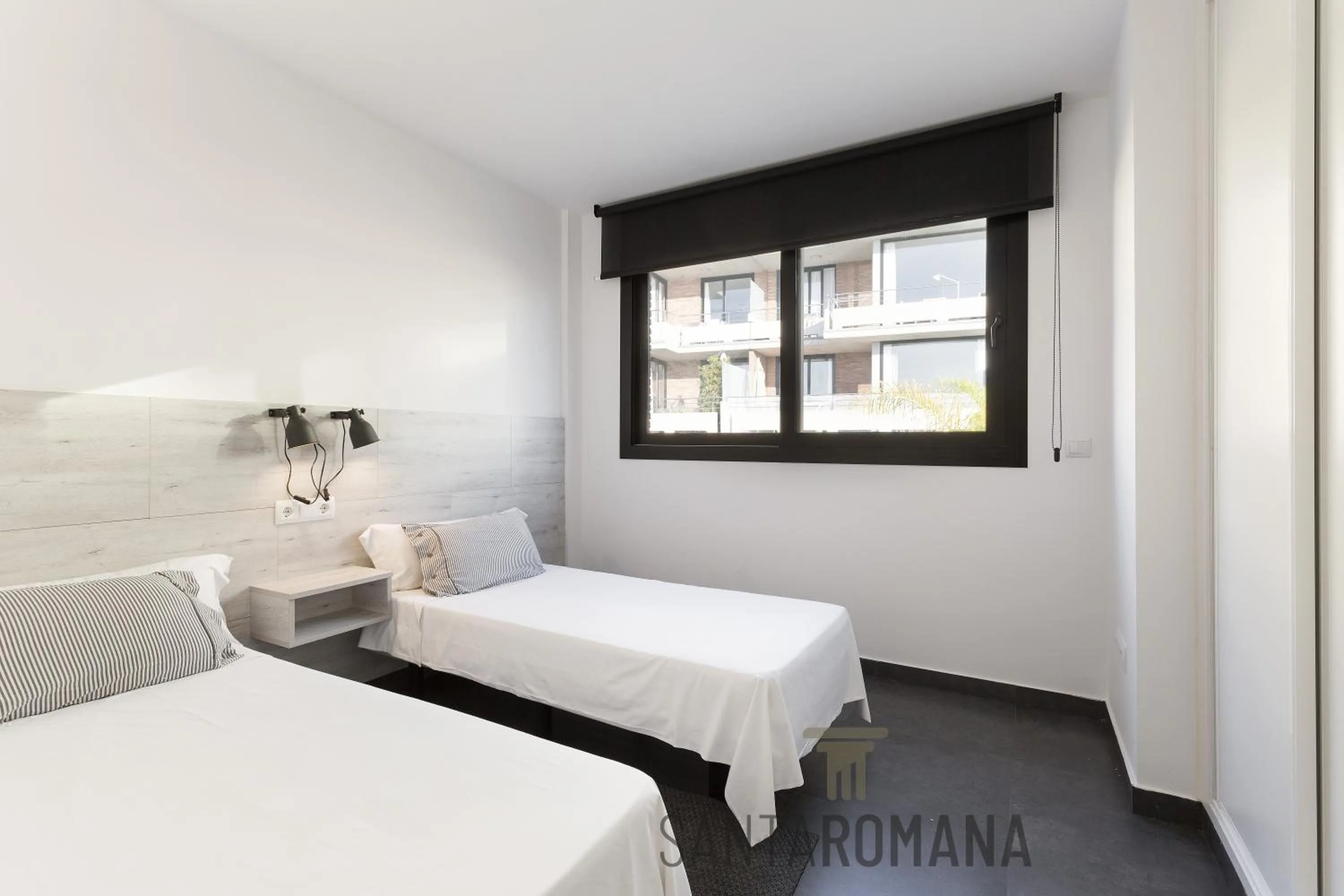 Bed in Santa Romana Apartments & Suites