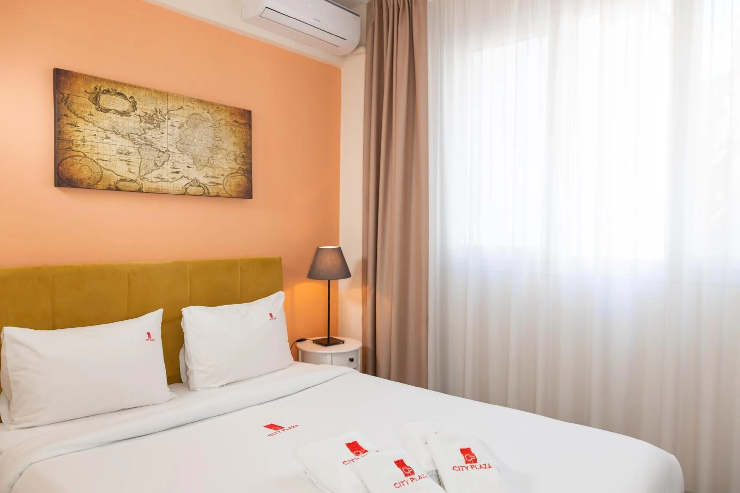 Bed in City Plaza Apartments & Rooms