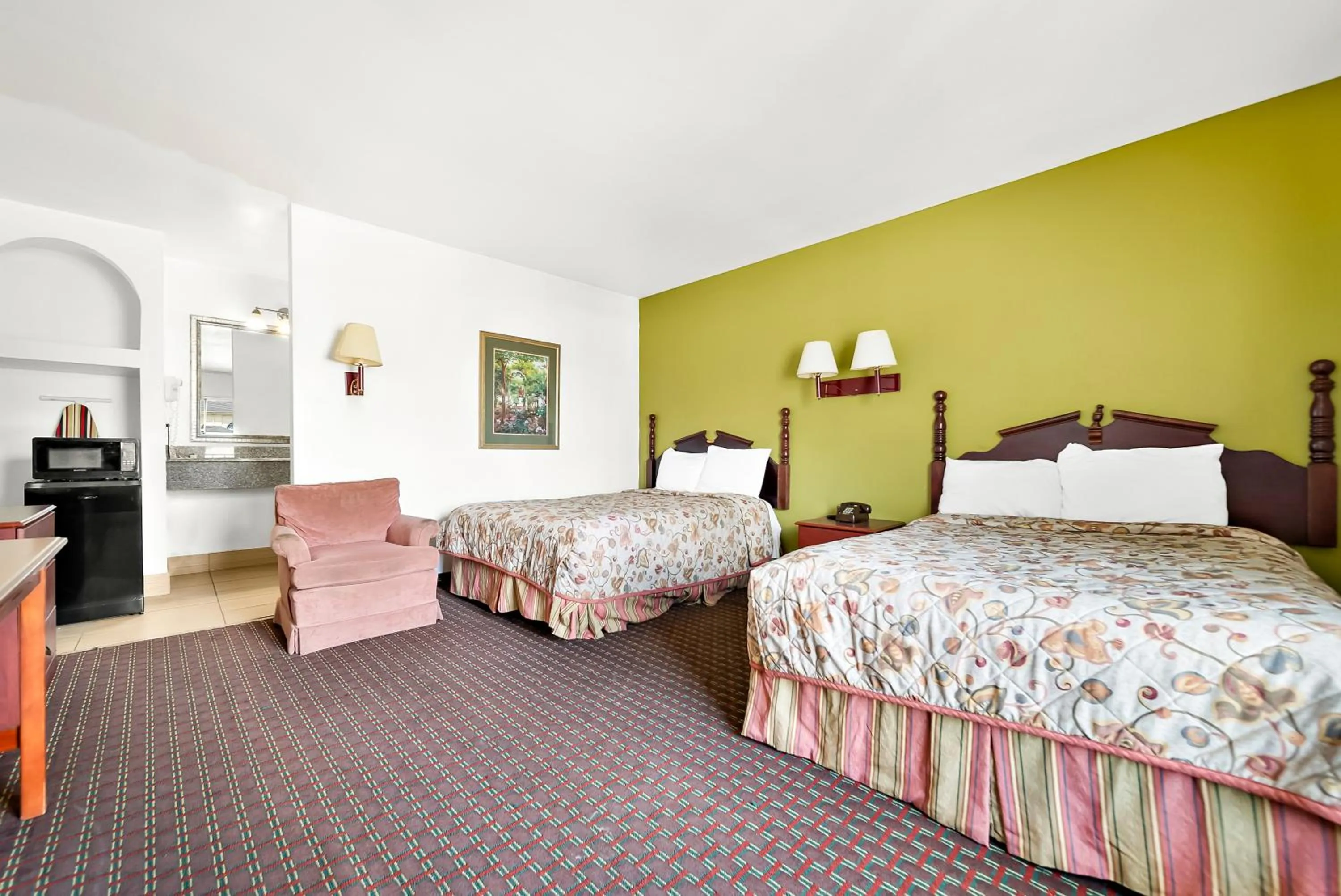 Bed in Capitol Inn and Suites