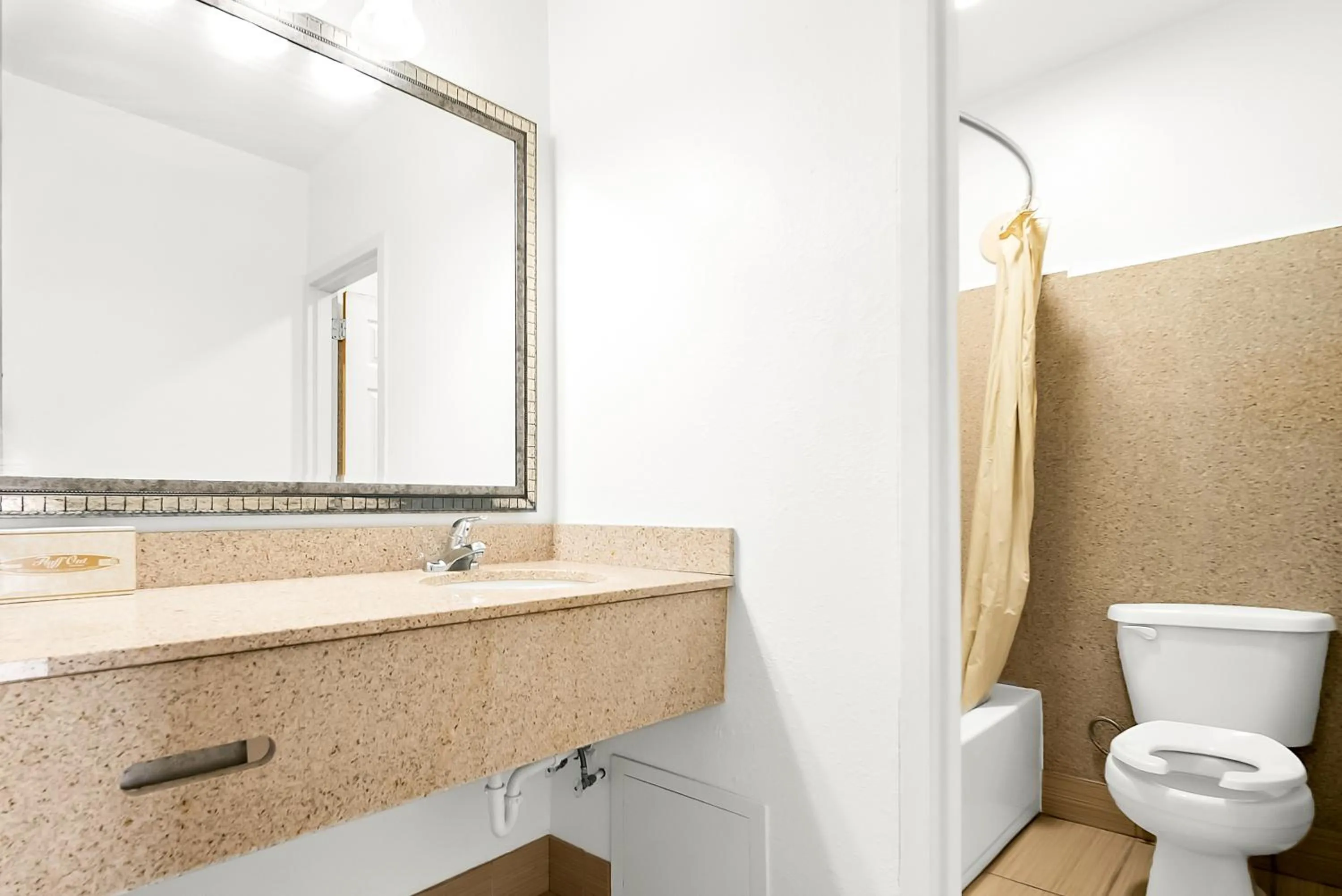 Toilet in Capitol Inn and Suites