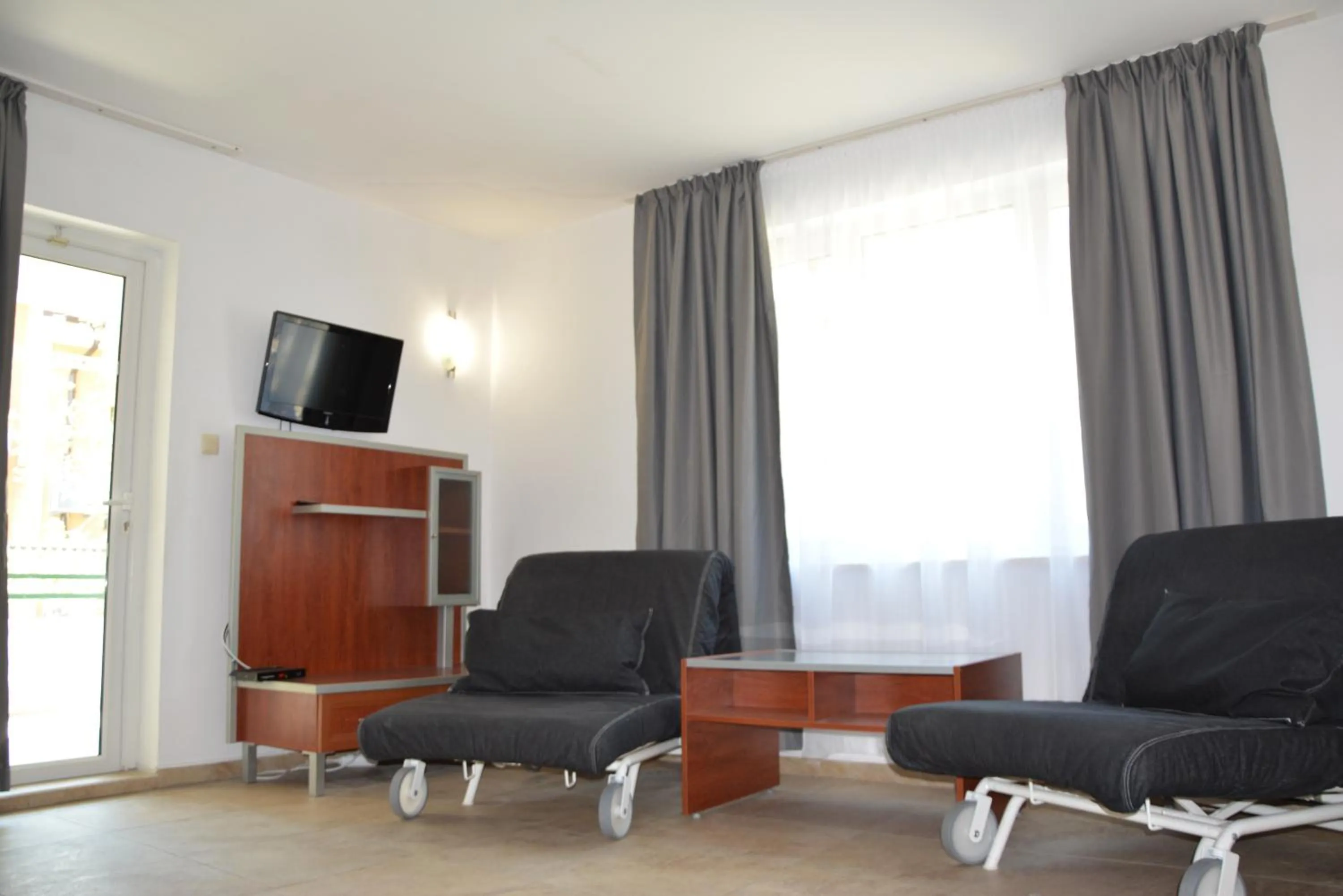 Communal lounge/ TV room in Milennia Family Hotel